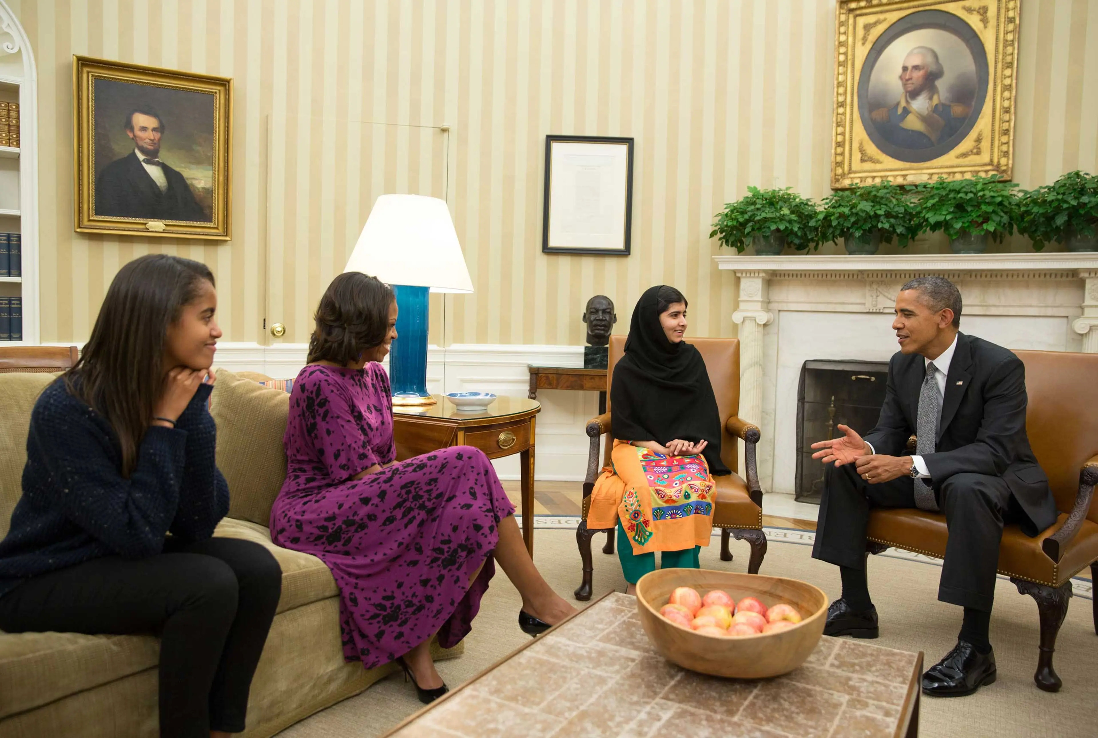 In this handout image provided by the White House, the Obama family meets with Malala Yousafzai in the Oval Office on Oct. 11, 2013 in Washington, DC.