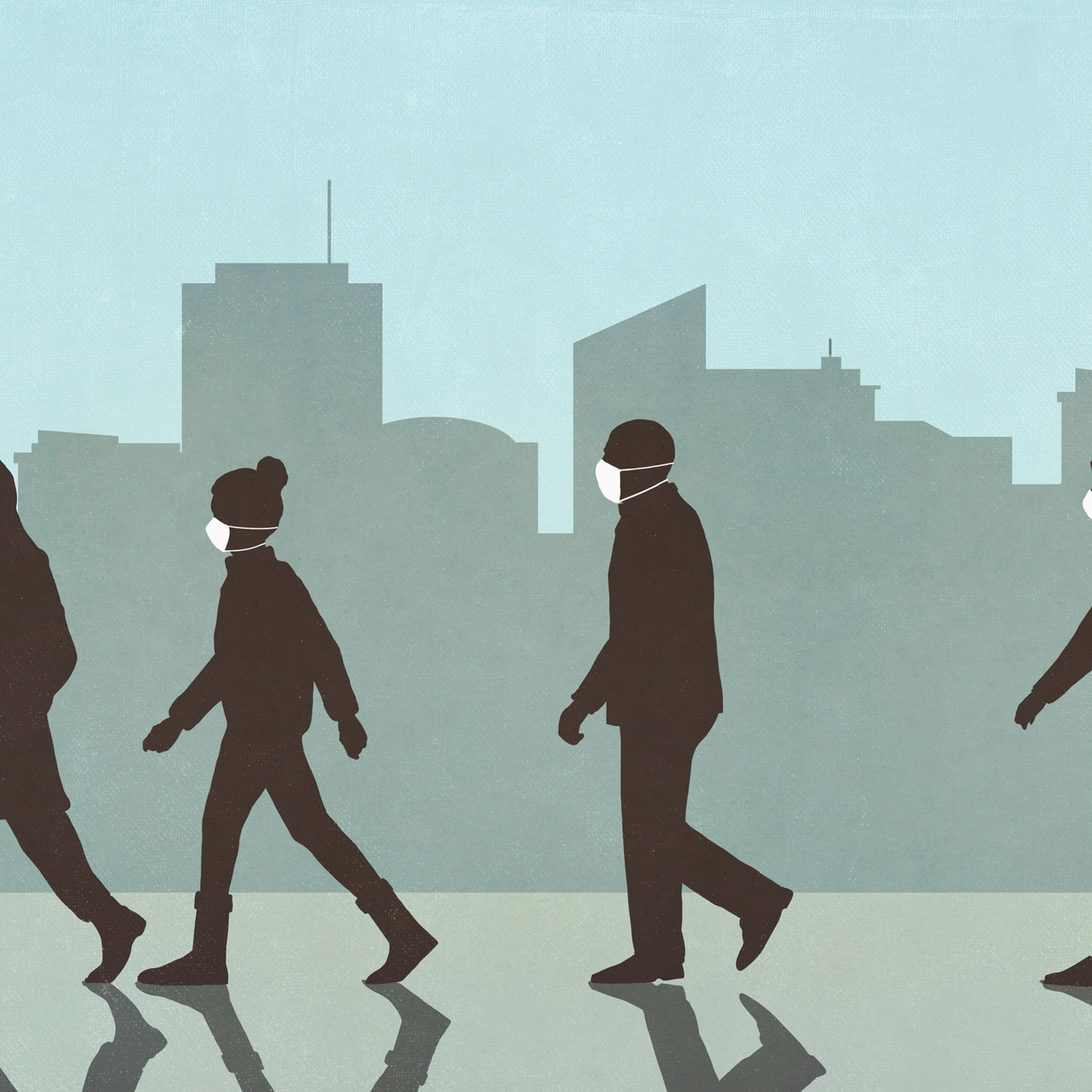 Pedestrians in masks walking in the city