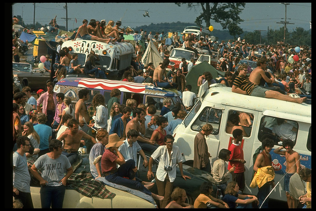 Large crowd of people, incl. people sitting on top