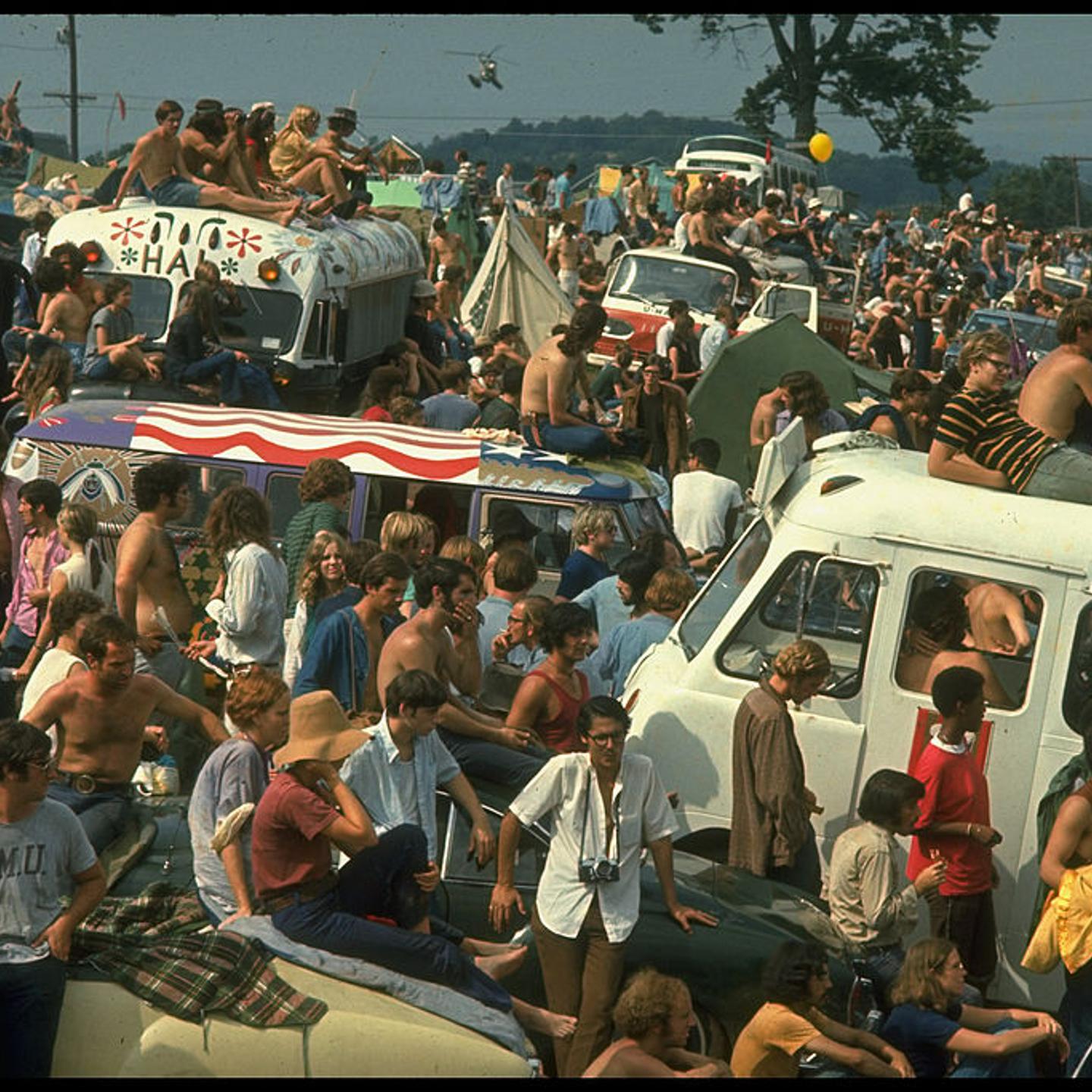 Large crowd of people, incl. people sitting on top