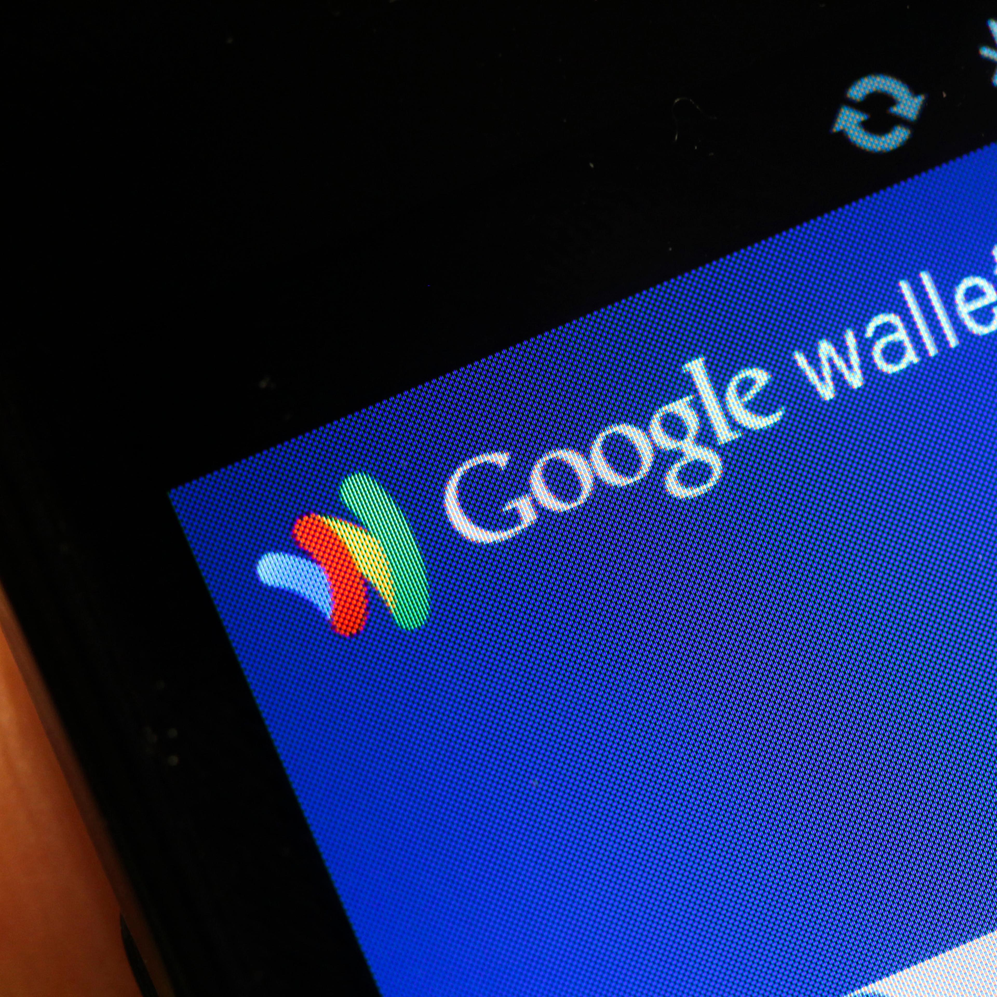 The Google Inc. Mobile Wallet application is displayed on a smartphone screen at the Mobile World Congress in Barcelona, Spain, on Feb. 29, 2012.