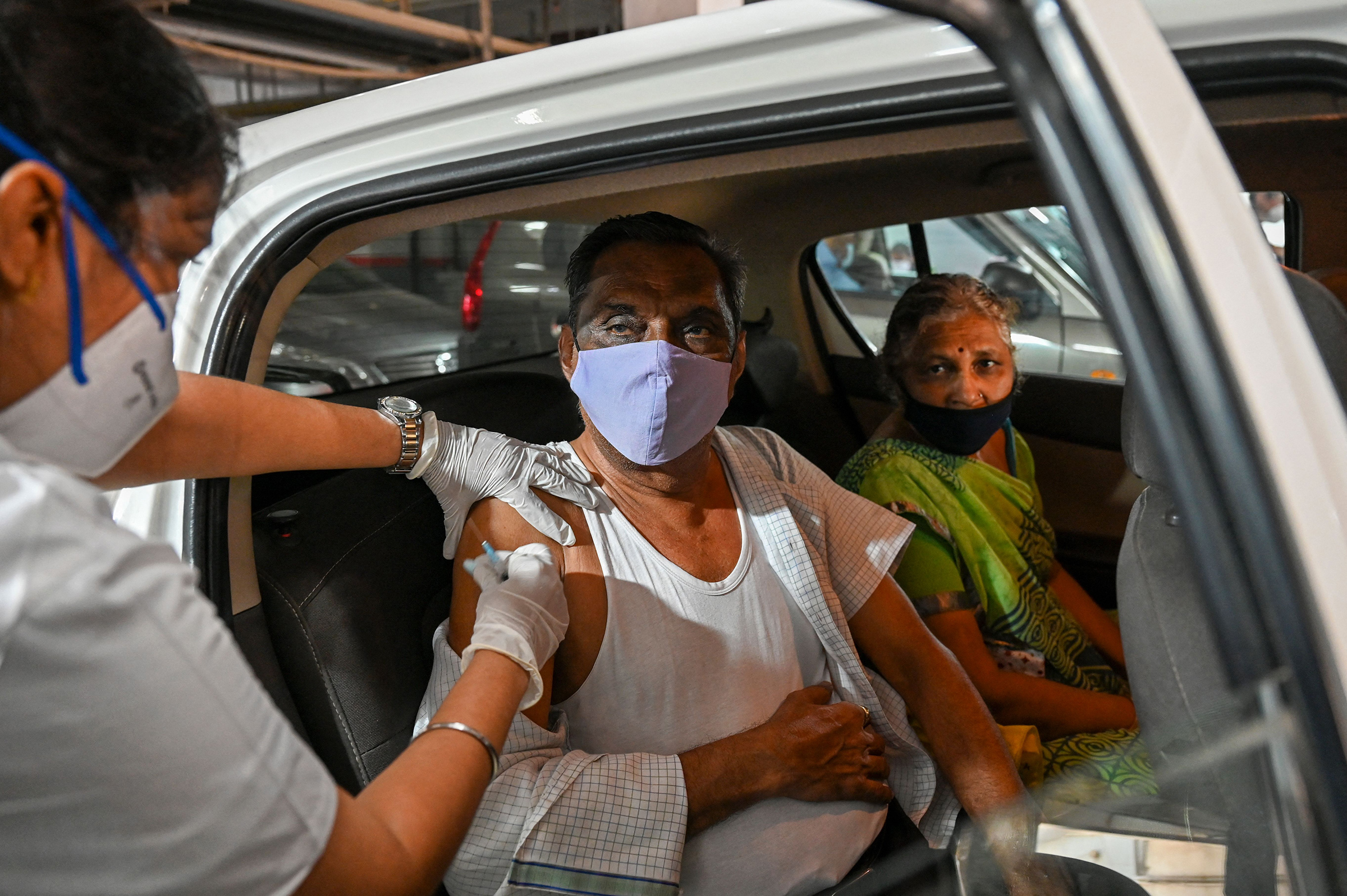 An elderly man receives a dose of the Covishield vaccine in Mumbai on May 4, 2021.