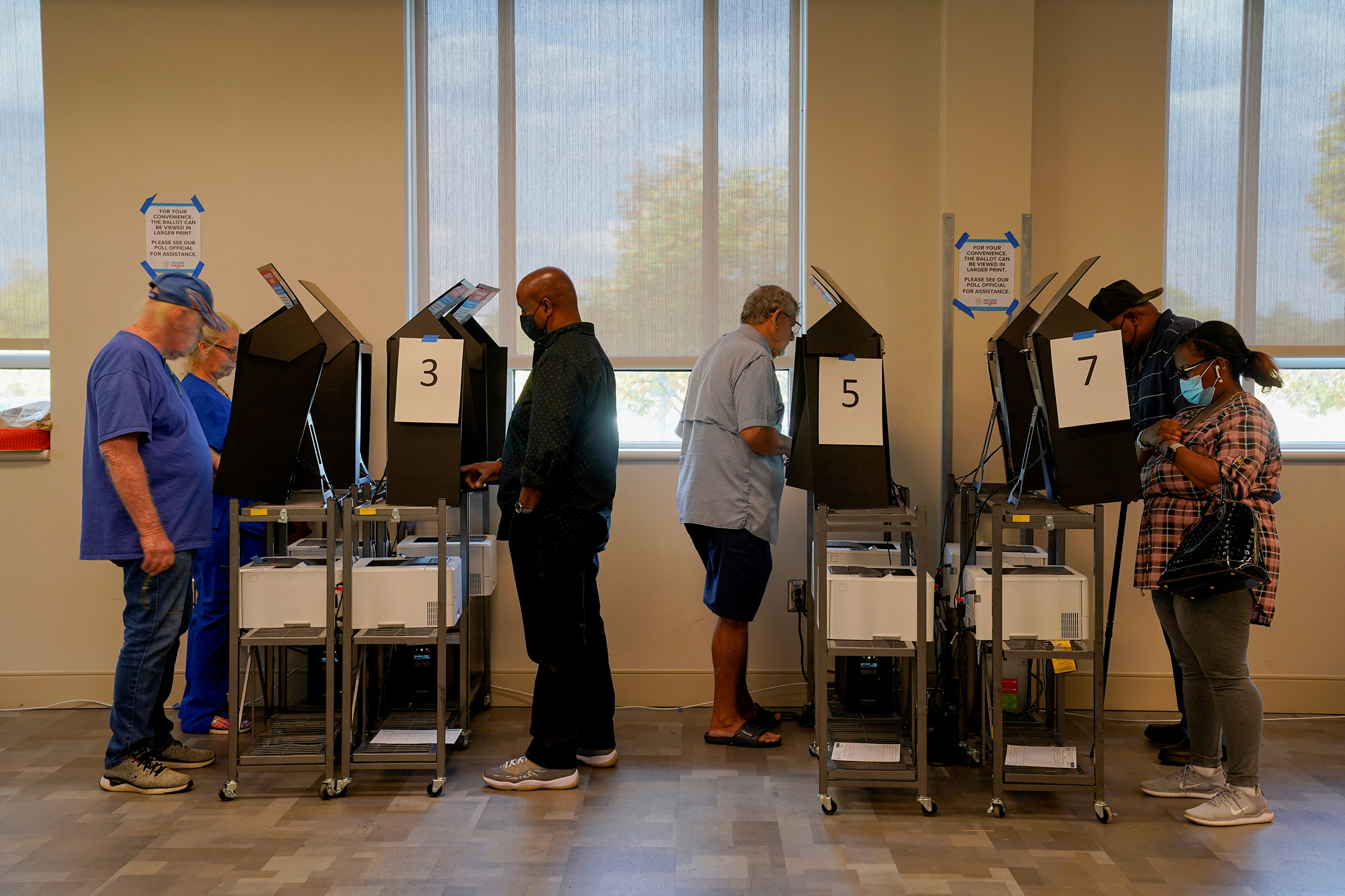 People use voting machines to fill out and cast their ballots as early voting begins for the midterm elections at the Citizens Service Center in Columbus, Georgia, on Oct. 17.