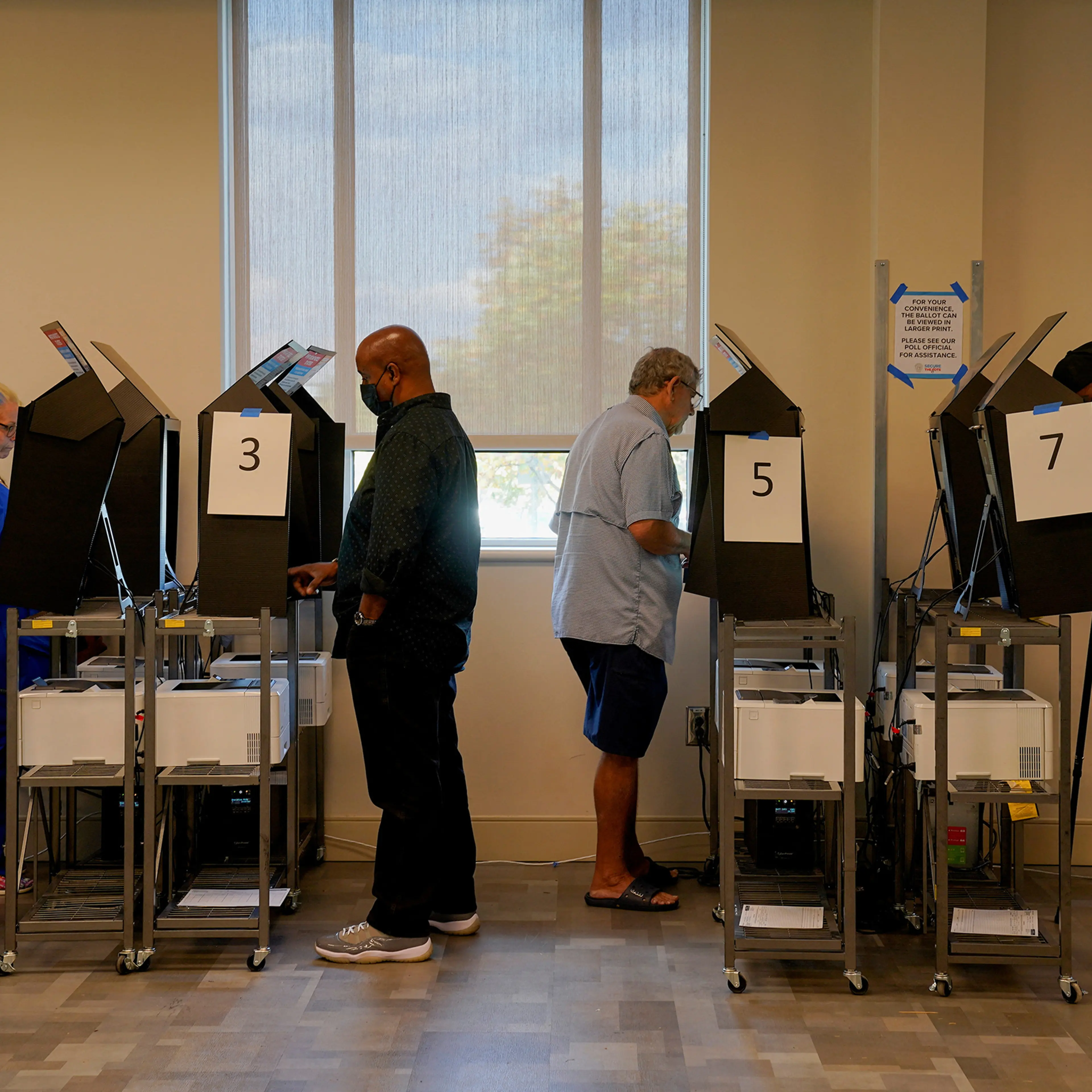 People use voting machines to fill out and cast their ballots as early voting begins for the midterm elections at the Citizens Service Center in Columbus, Georgia, on Oct. 17.