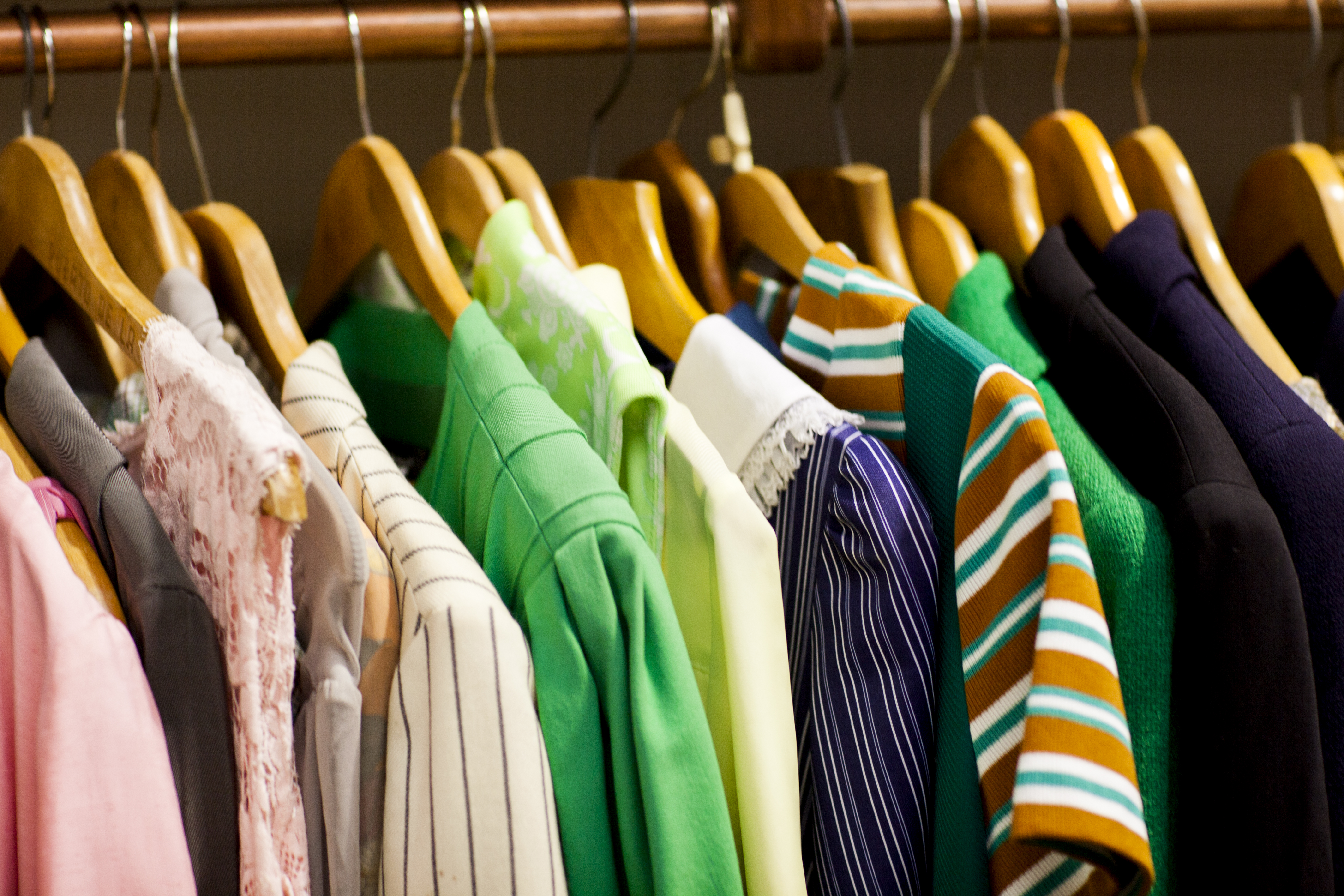 Vintage clothes on clothes rail in antique and vintage emporium