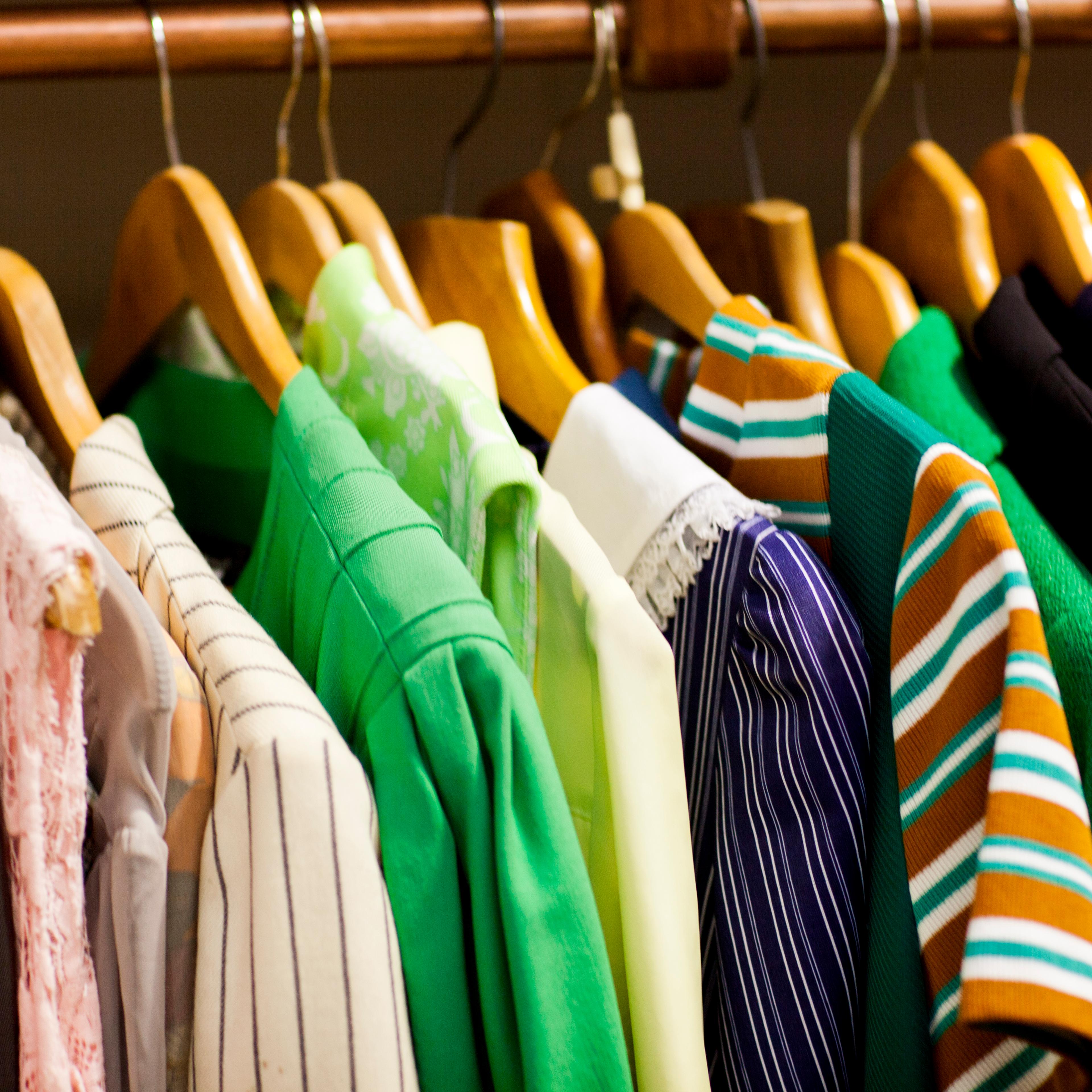 Vintage clothes on clothes rail in antique and vintage emporium