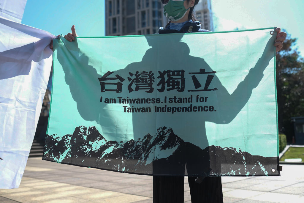 An activist holds a banner calling for Taiwanese independence in Taipei, Taiwan, on Jan. 26, 2022.
