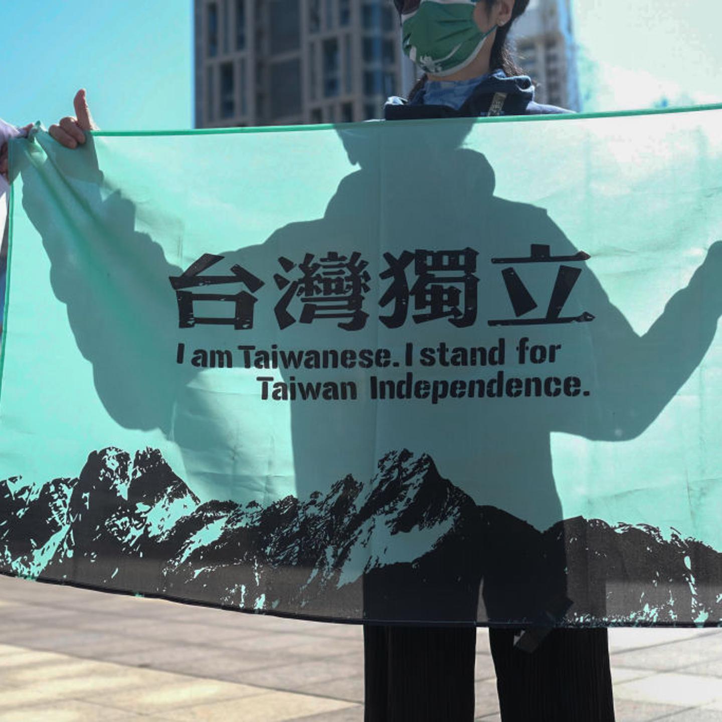 An activist holds a banner calling for Taiwanese independence in Taipei, Taiwan, on Jan. 26, 2022.