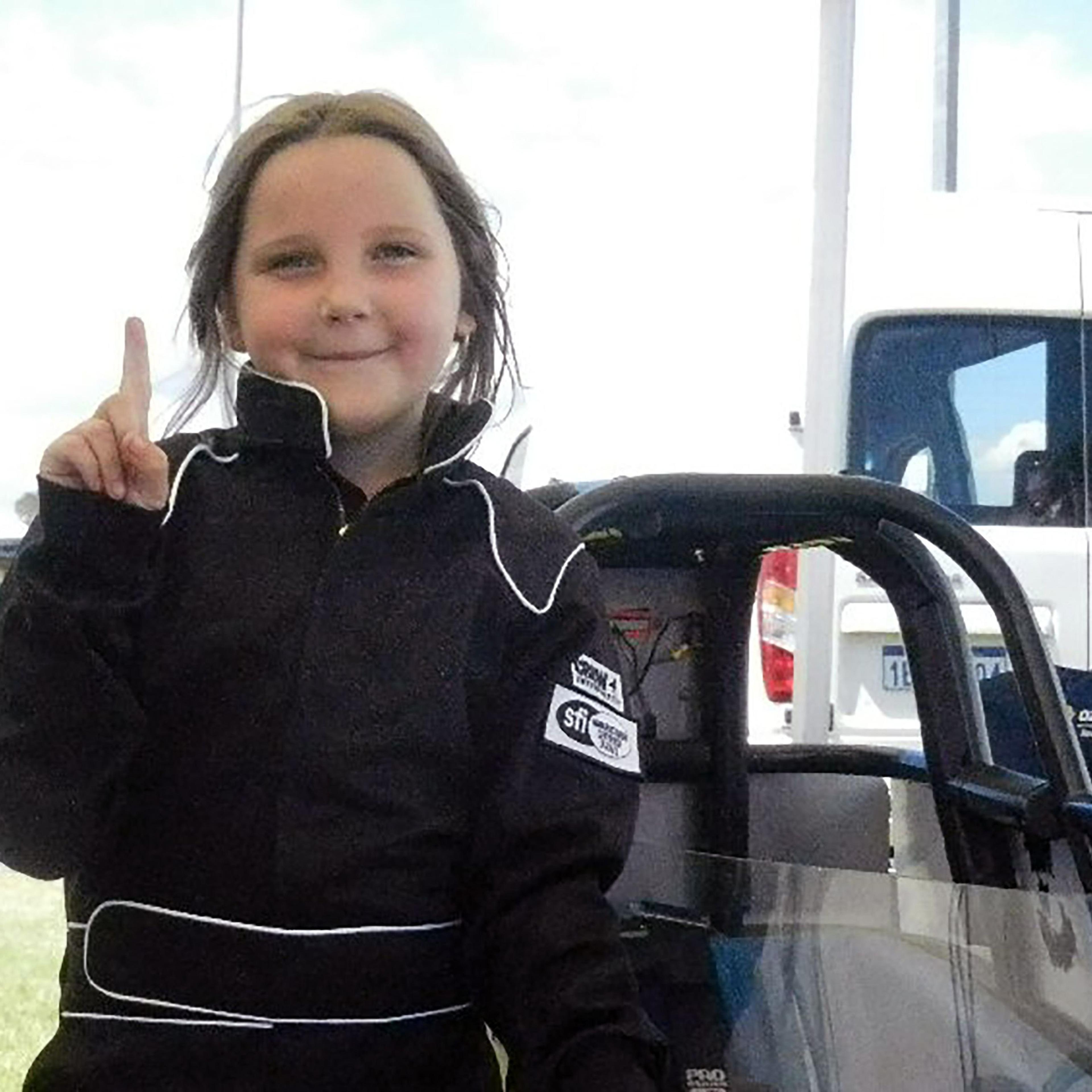 A handout photo from Junior Dragster Australia on Oct. 14, 2017, shows Anita Board, 8, next to her junior dragster racing car.