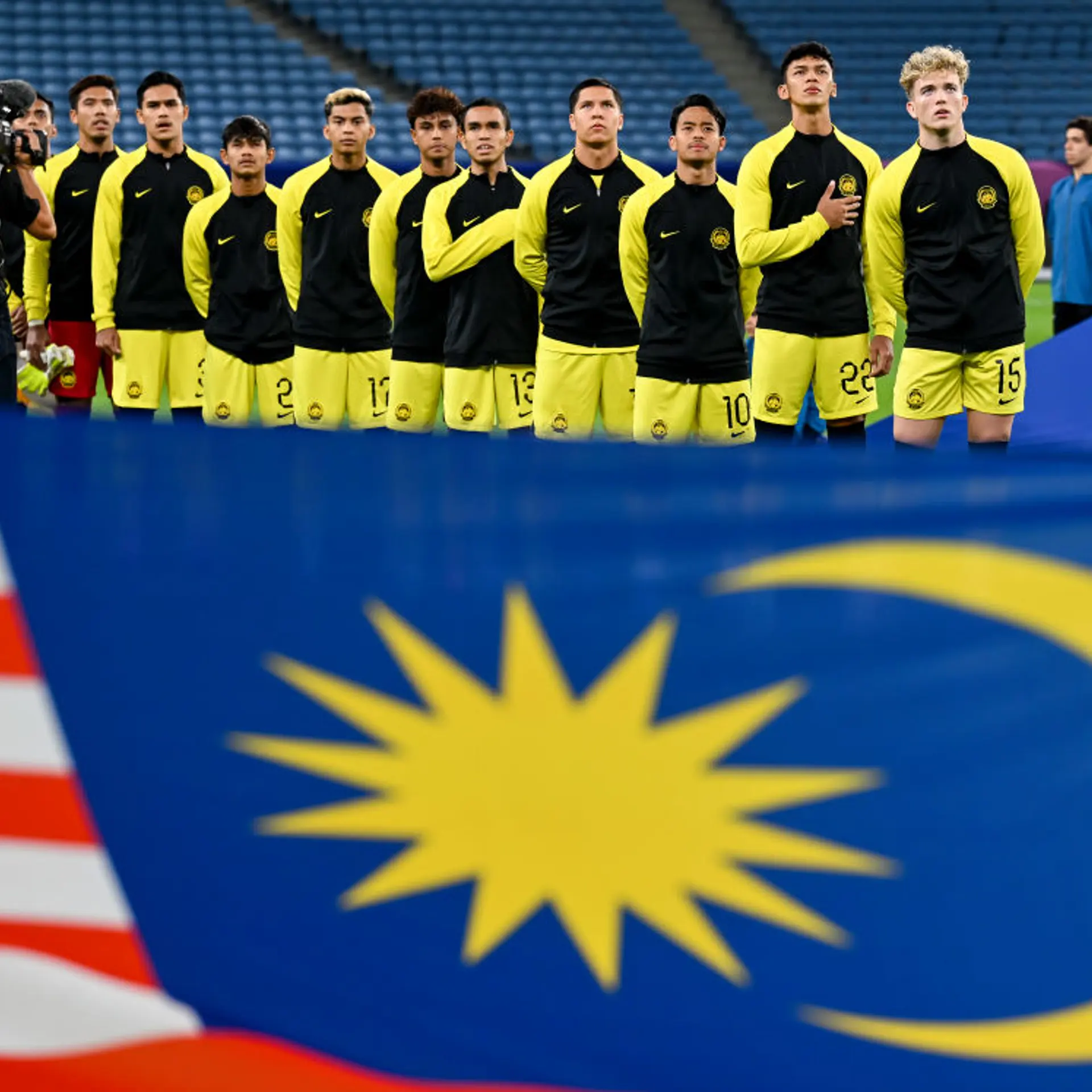 Malaysian players stand for the national anthem ahead of a match at the AFC U23 Asian Cup at Al Janoub Stadium in Doha, Qatar, on April 23, 2024.