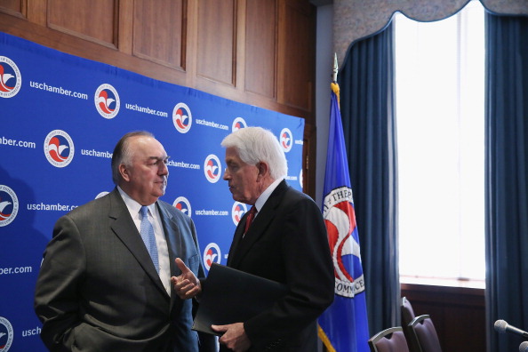 Business Roundtable President and former Michigan Gov. John Engler (L) talks with U.S. Chamber of Commerce President and CEO Thomas Donohue after a news conference as part of a 'Day of Action for Immigration Reform' at the U.S. Chamber of Commerce July 9