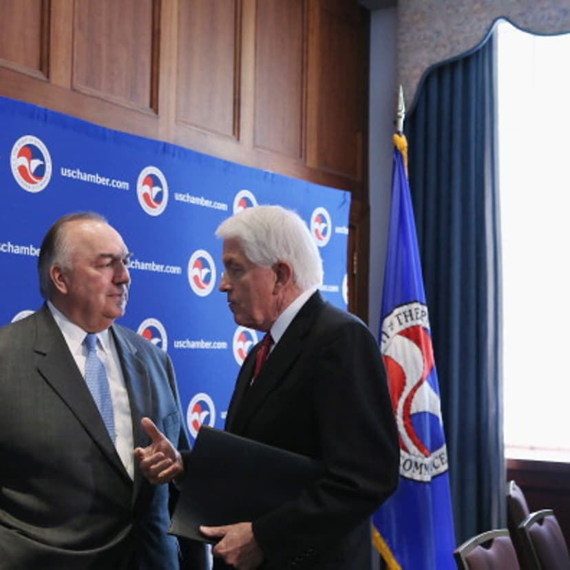 Business Roundtable President and former Michigan Gov. John Engler (L) talks with U.S. Chamber of Commerce President and CEO Thomas Donohue after a news conference as part of a 'Day of Action for Immigration Reform' at the U.S. Chamber of Commerce July 9