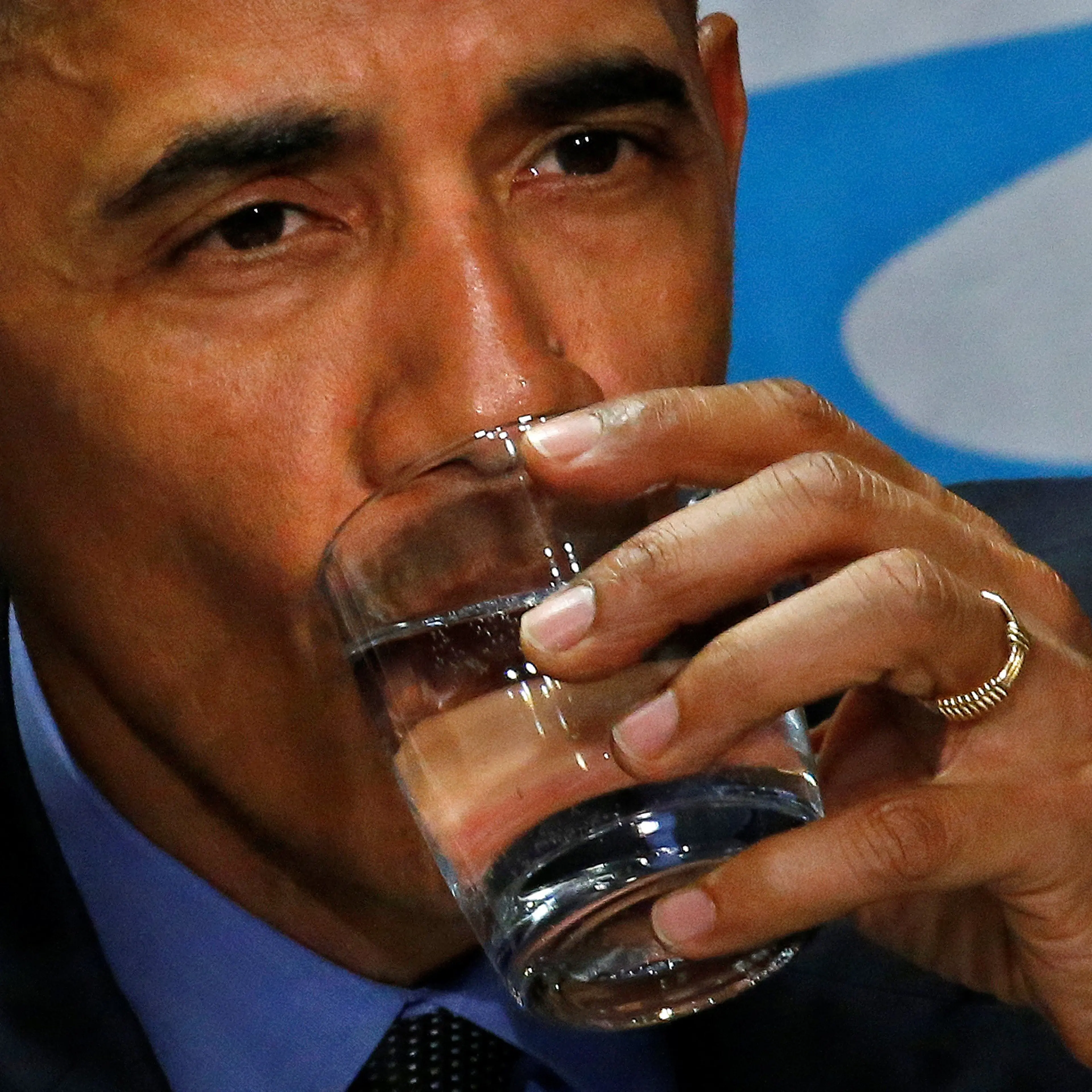 U.S. President Barack Obama drinks a glass of filtered water from Flint, a city struggling with the effects of lead-poisoned drinking water, during a meeting will local and federal authorities in Michigan