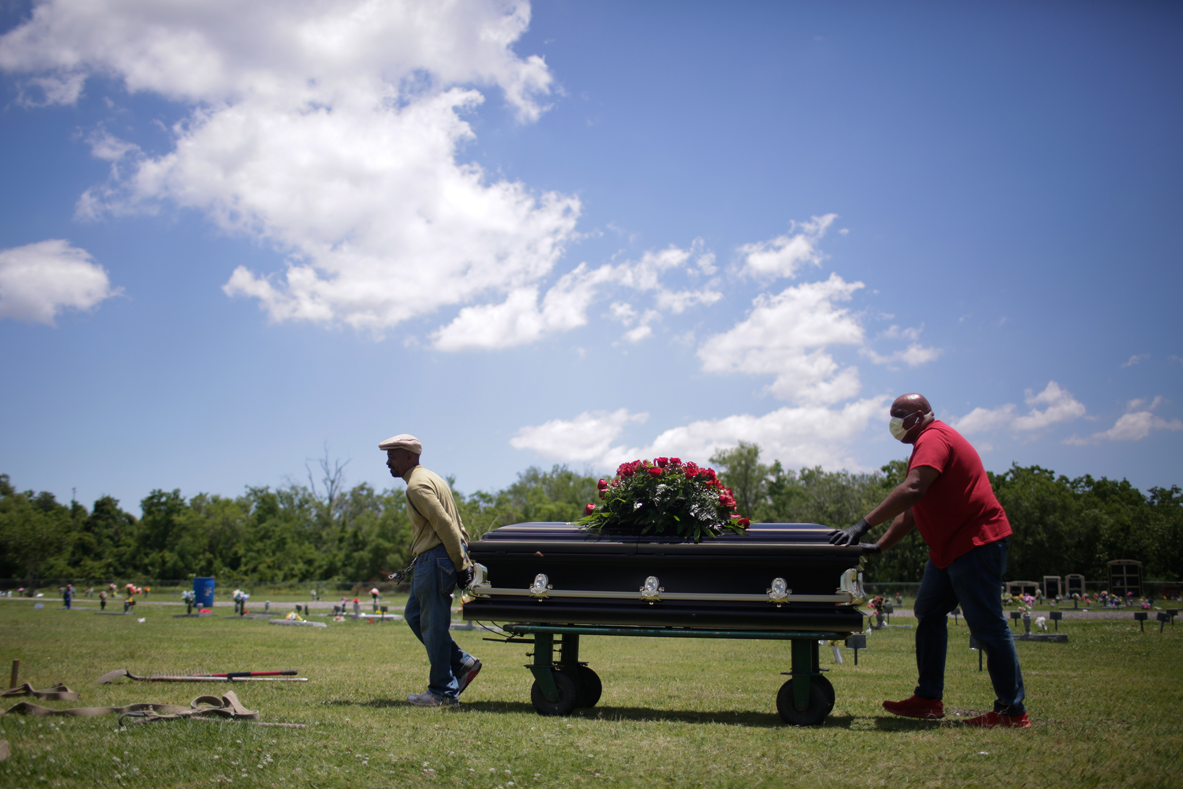 Michael Williams’ casket is carried toward his plot at Woodlawn Park Memorial Cemetery in Westwego, La., on May 18, 2020