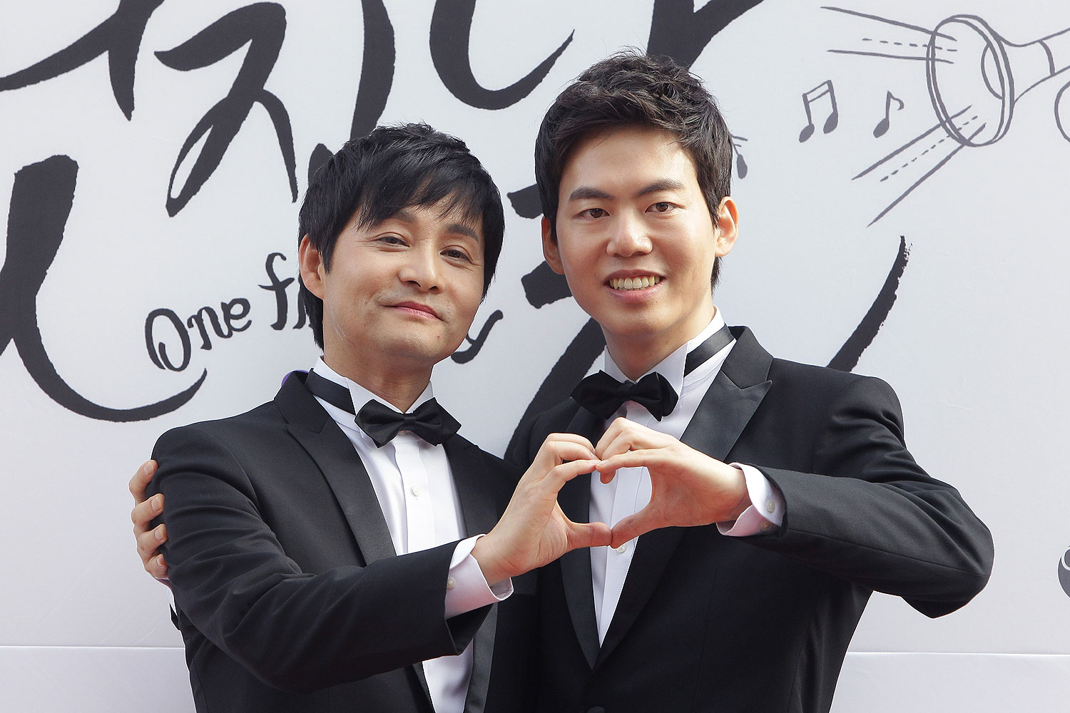 Director Kim Jho Kwang-Soo and Kim Seung-Hwan pose before their wedding in Seoul in Sept. 2013