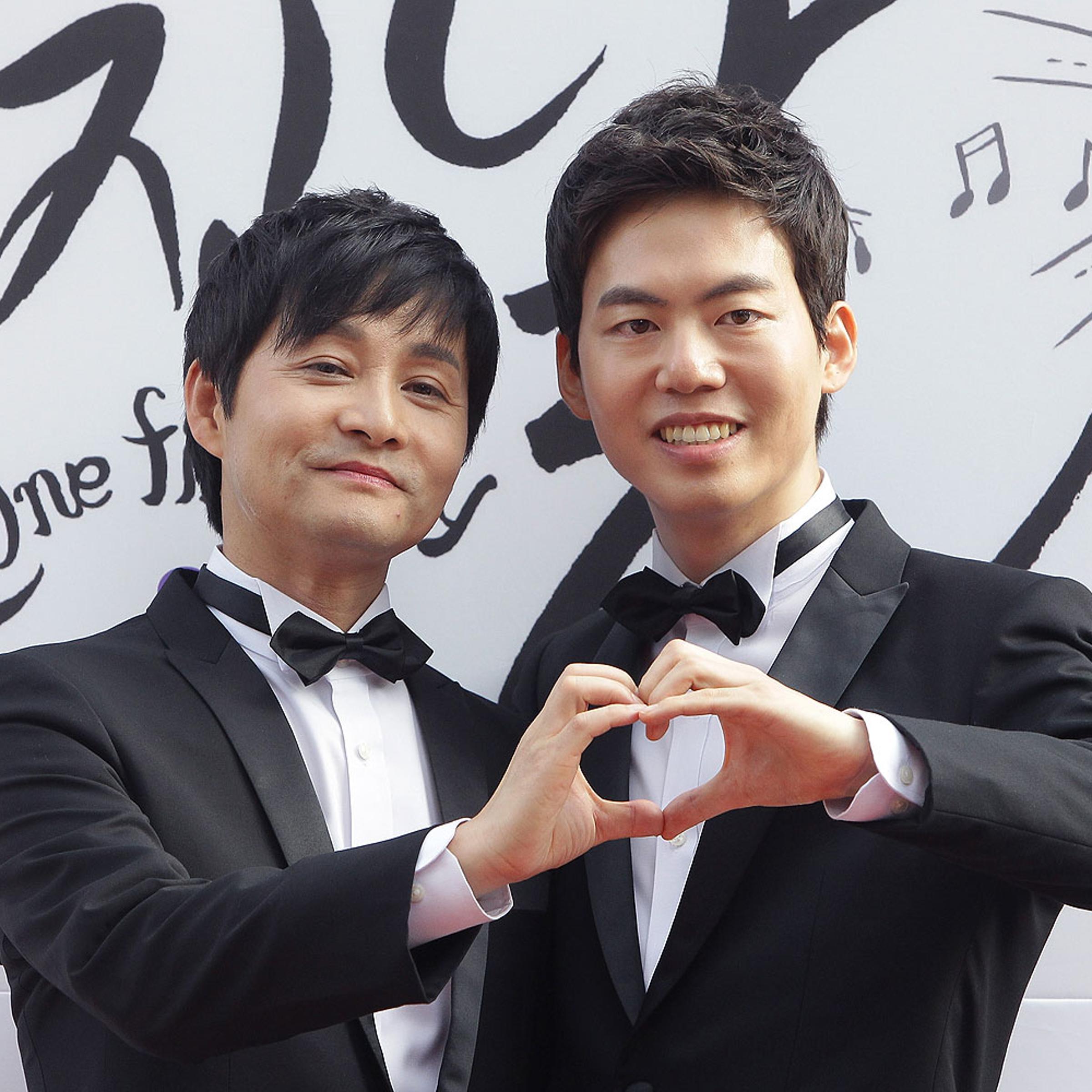 Director Kim Jho Kwang-Soo and Kim Seung-Hwan pose before their wedding in Seoul in Sept. 2013
