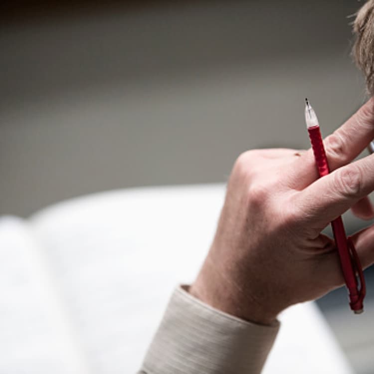 man-thinking-holding-pen