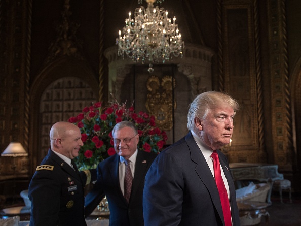 US President Donald Trump (R) walks away after naming US Army Lieutenant General H.R. McMaster (L) as his national security adviser and Keith Kellogg (C) as McMaster's chief of staff at his Mar-a-Lago resort in Palm Beach, Florida, on February 20, 2017.