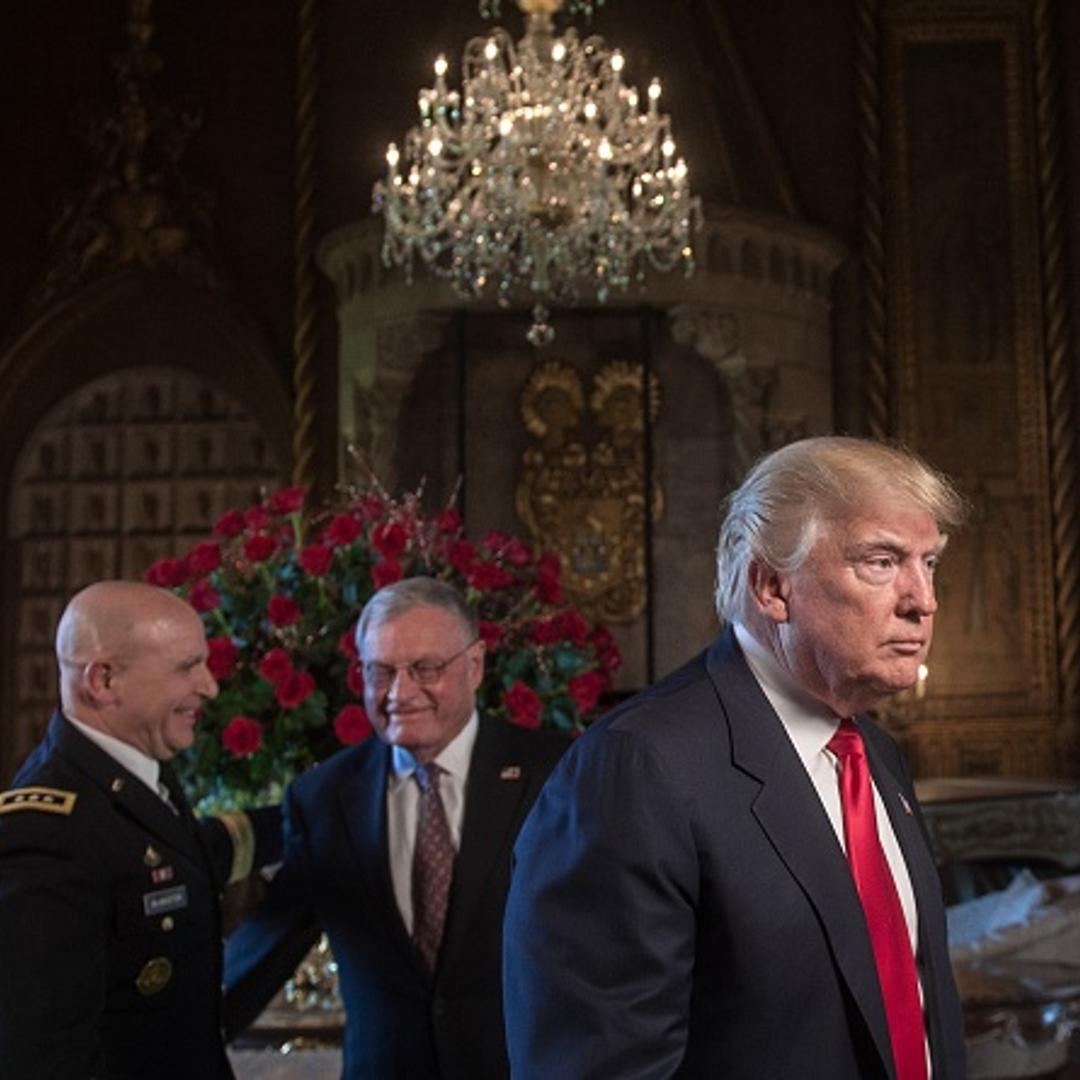 US President Donald Trump (R) walks away after naming US Army Lieutenant General H.R. McMaster (L) as his national security adviser and Keith Kellogg (C) as McMaster's chief of staff at his Mar-a-Lago resort in Palm Beach, Florida, on February 20, 2017.