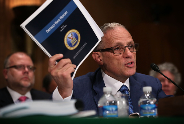 Fred Hochberg, Chairman and President of the Export-Import Bank of the United States holds up a copy of the bank's Default Rate Report as he testifies during a hearing before the Senate Banking, Housing and Urban Affairs Committee June 4, 2015 on Capitol