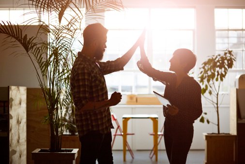 coworkers-high-five-office