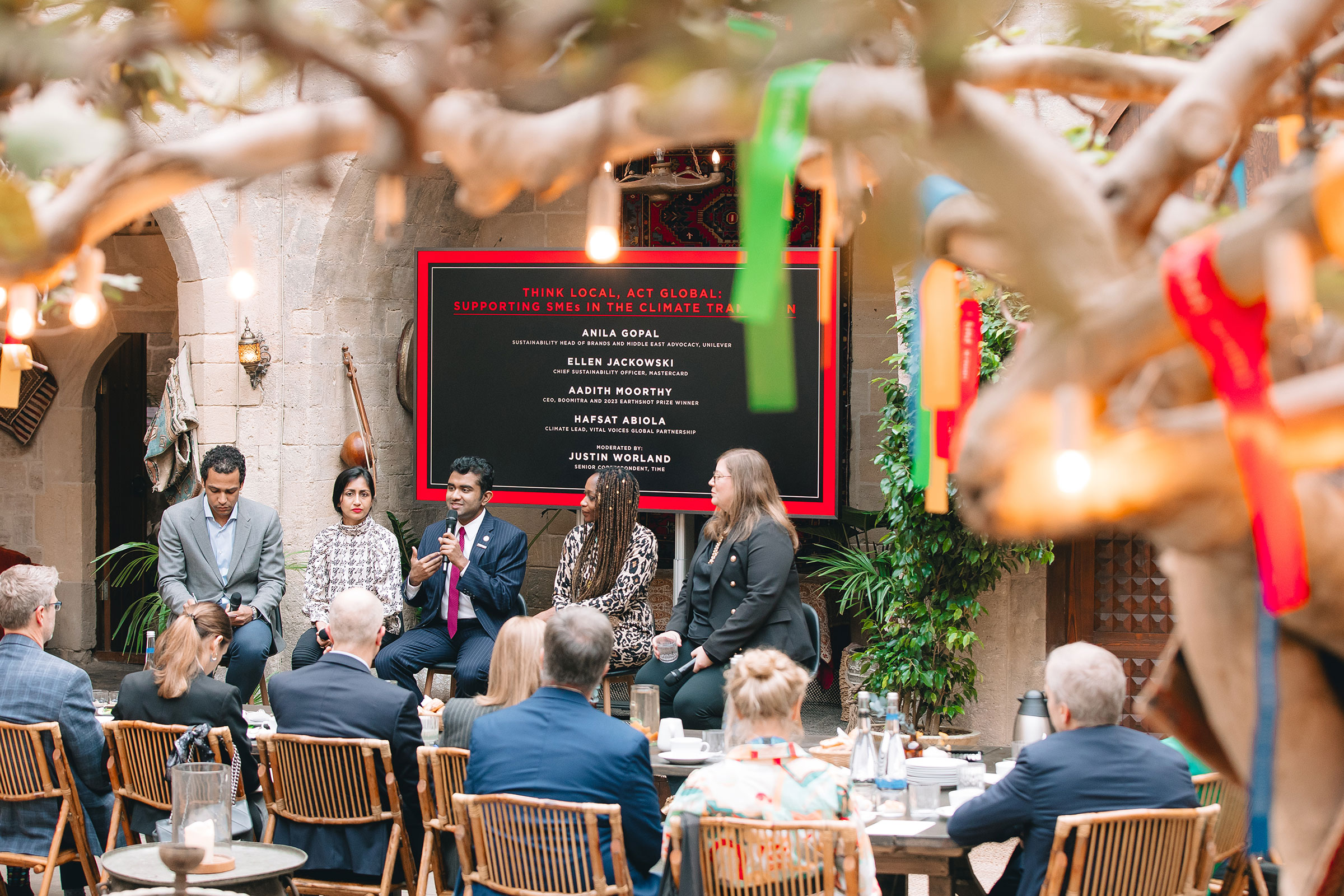 TIME Senior Correspondent Justin Worland moderates a panel between Anila Gopal, Aadith Moorthy, Hafsat Abiola, and Ellen Jackowski at the Think Local, Act Global: Supporting SMEs in the Climate Transition TIME100 Talk at COP29.