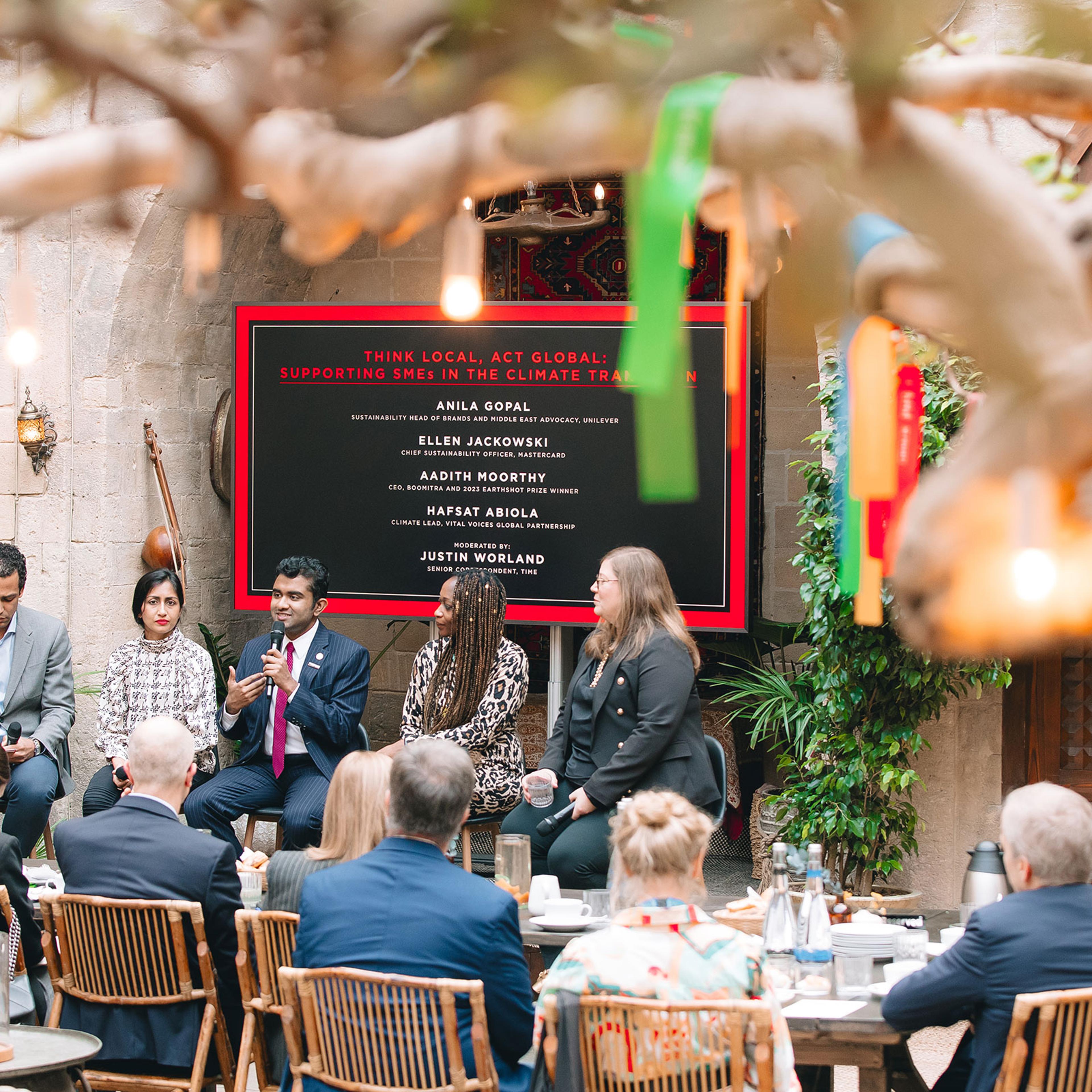TIME Senior Correspondent Justin Worland moderates a panel between Anila Gopal, Aadith Moorthy, Hafsat Abiola, and Ellen Jackowski at the Think Local, Act Global: Supporting SMEs in the Climate Transition TIME100 Talk at COP29.