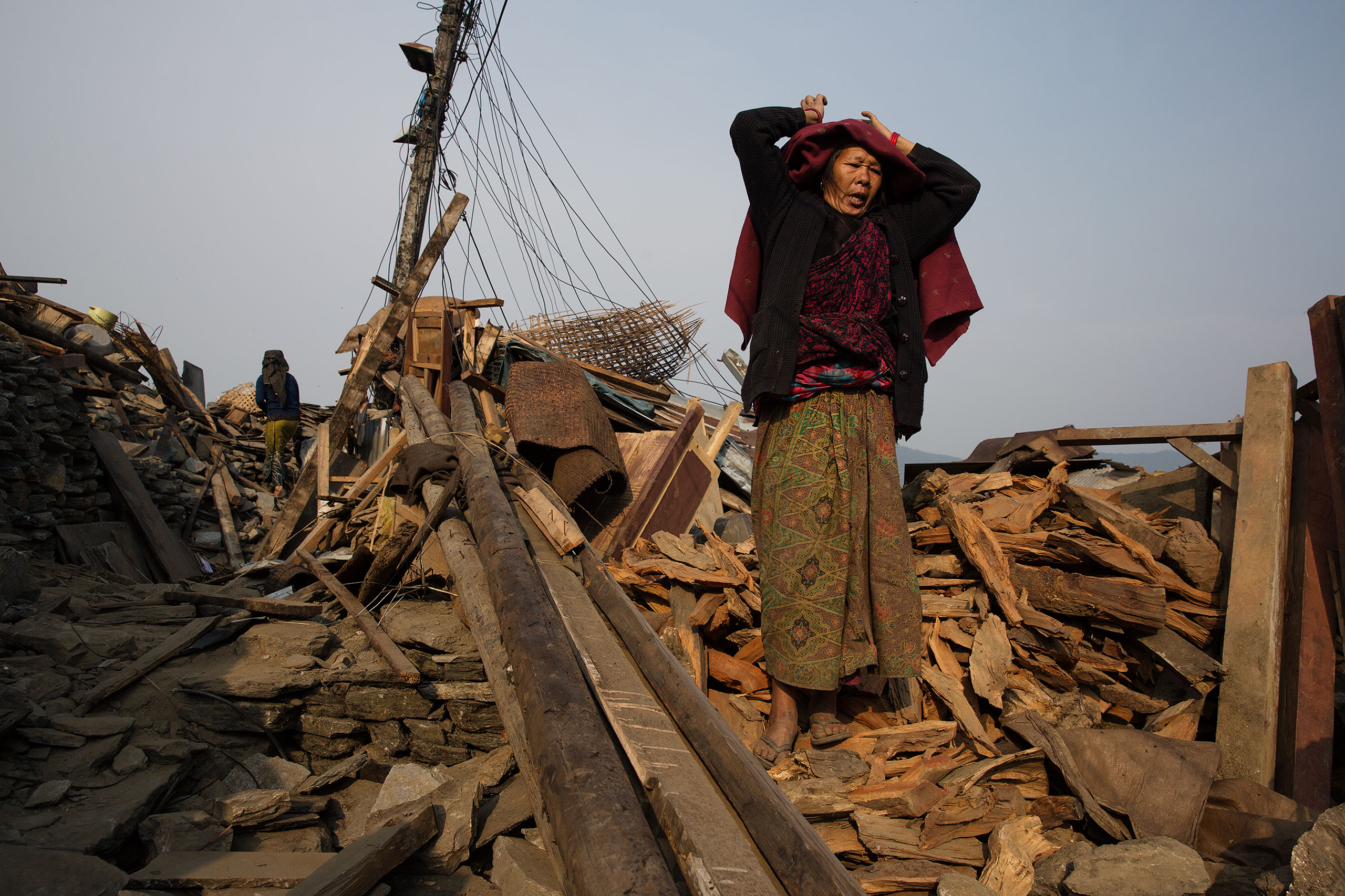 Nepal earthquake. Barpak, the epicenter of the earthquake. Inhabitants salvaging building materials and possessions from their destroyed houses. by James Nachtwey