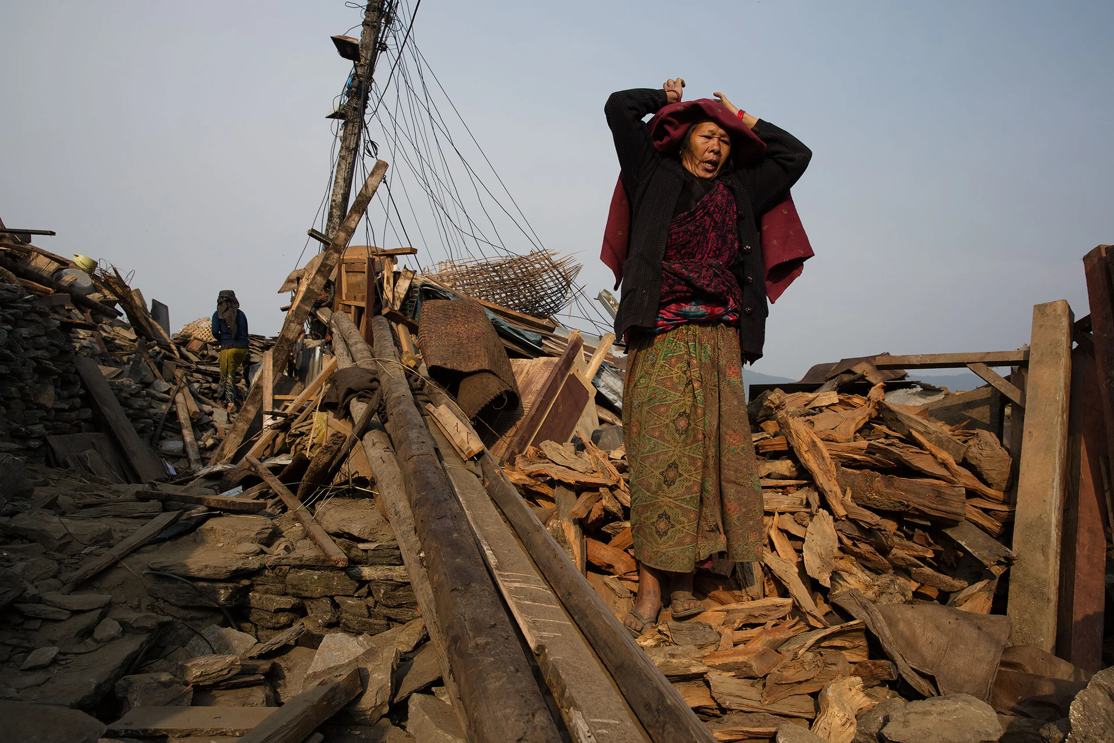 Nepal earthquake. Barpak, the epicenter of the earthquake. Inhabitants salvaging building materials and possessions from their destroyed houses. by James Nachtwey