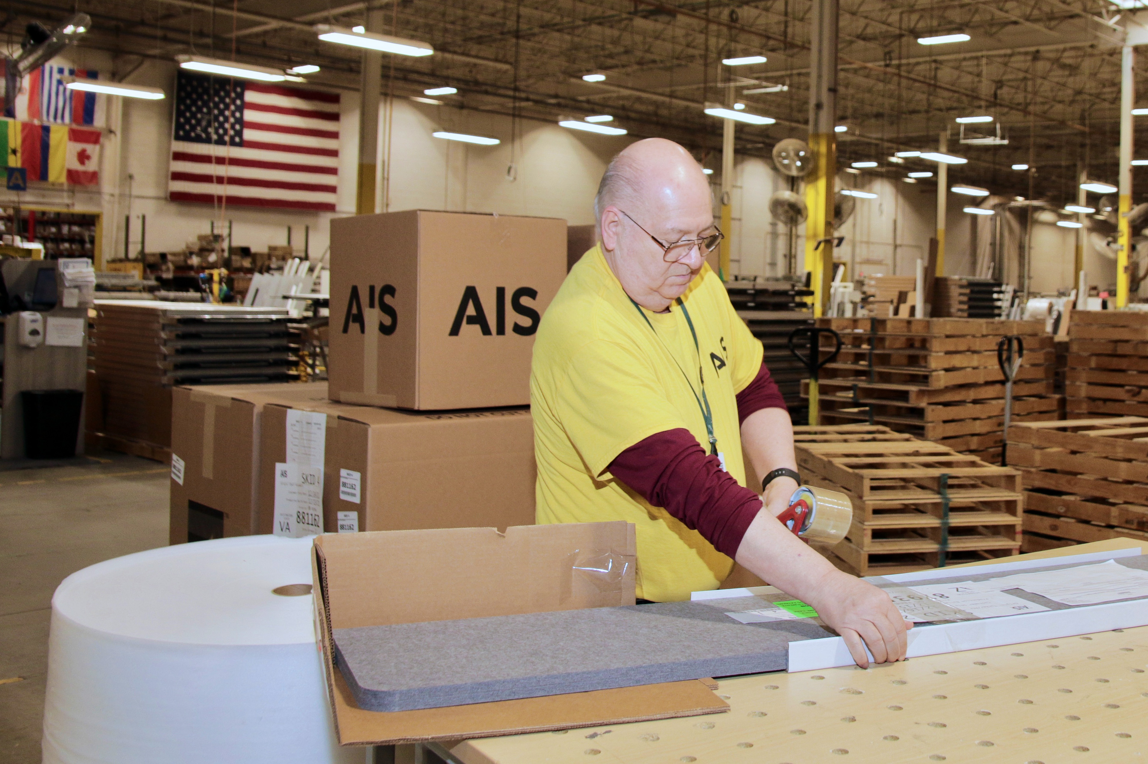 aging worker on an assembly line