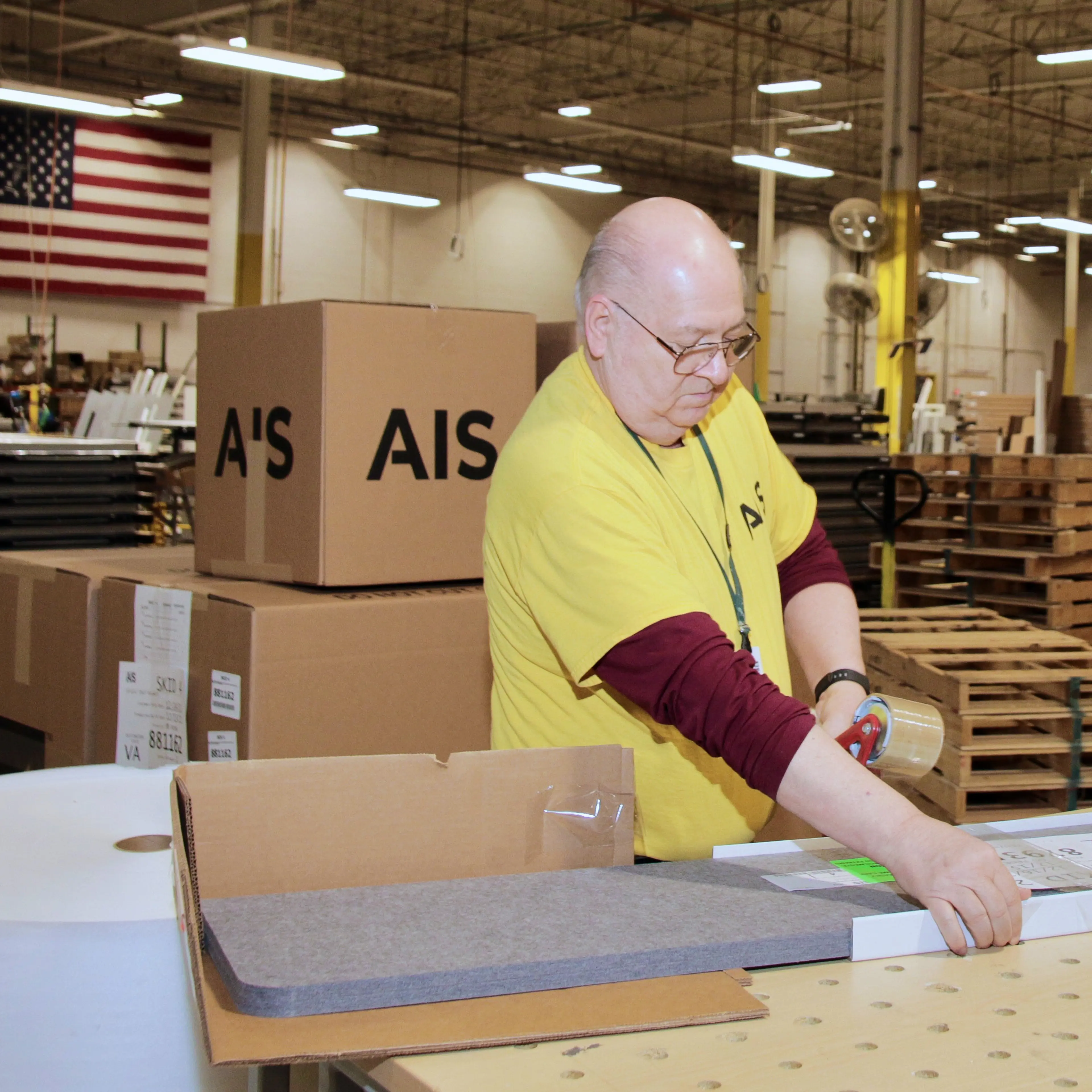 aging worker on an assembly line
