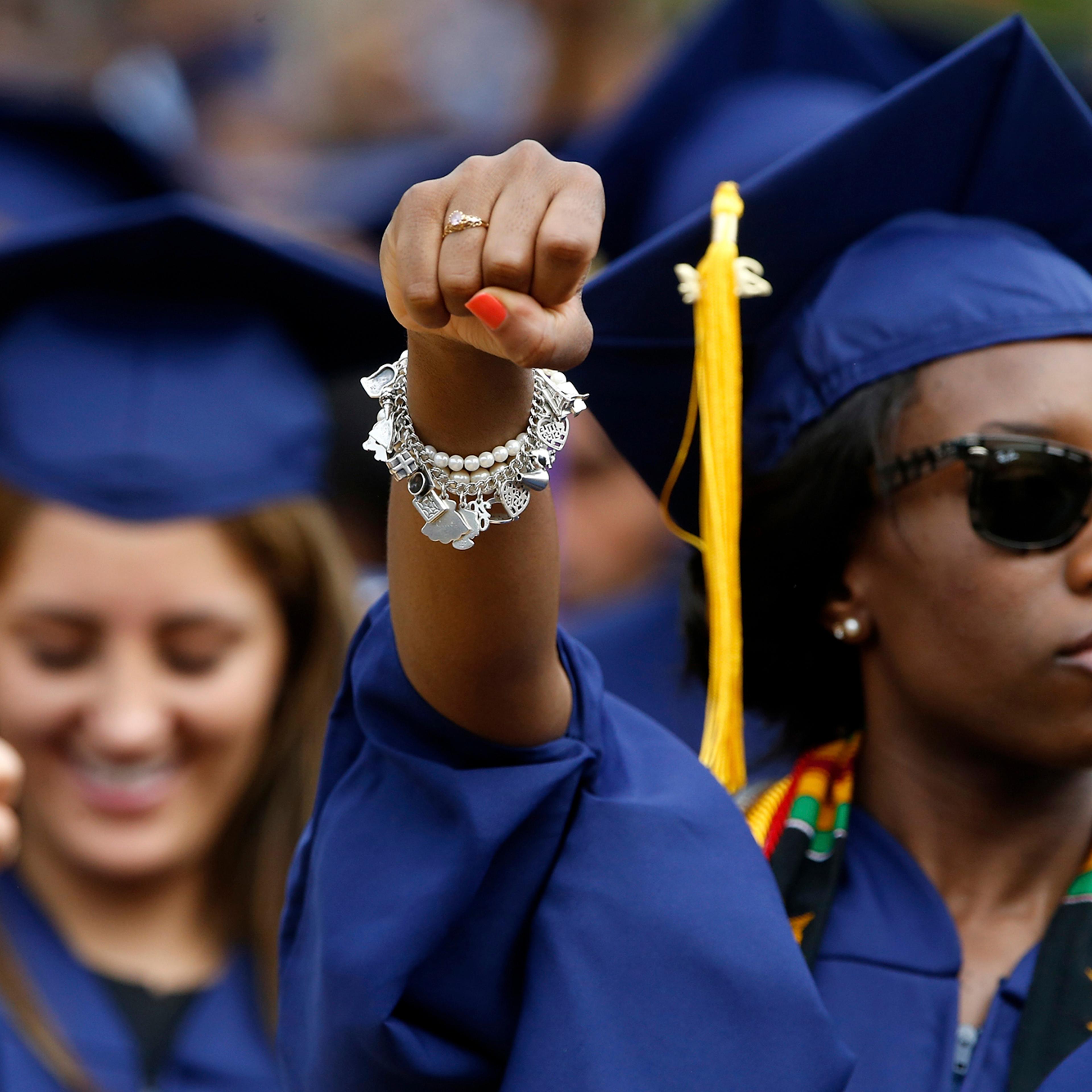 Graduates stand for the anthem "Lift Every Voice and Sing" during 2014 commencement ceremonies at Howard University in Washington May 10, 2014.