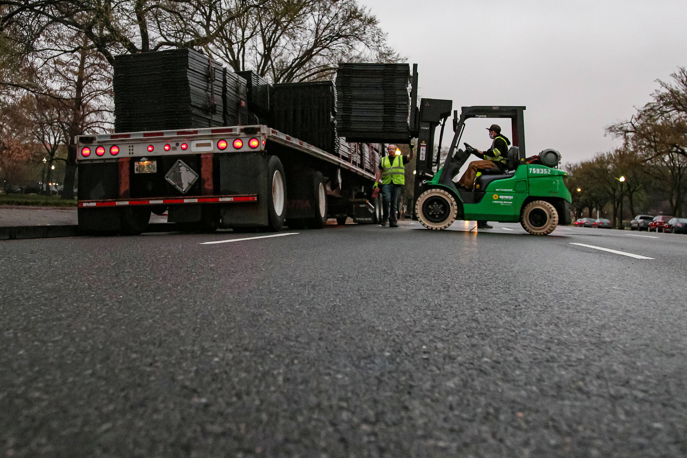 Workers remove fence at White House, Washington DC, USA - 24 Mar 2021