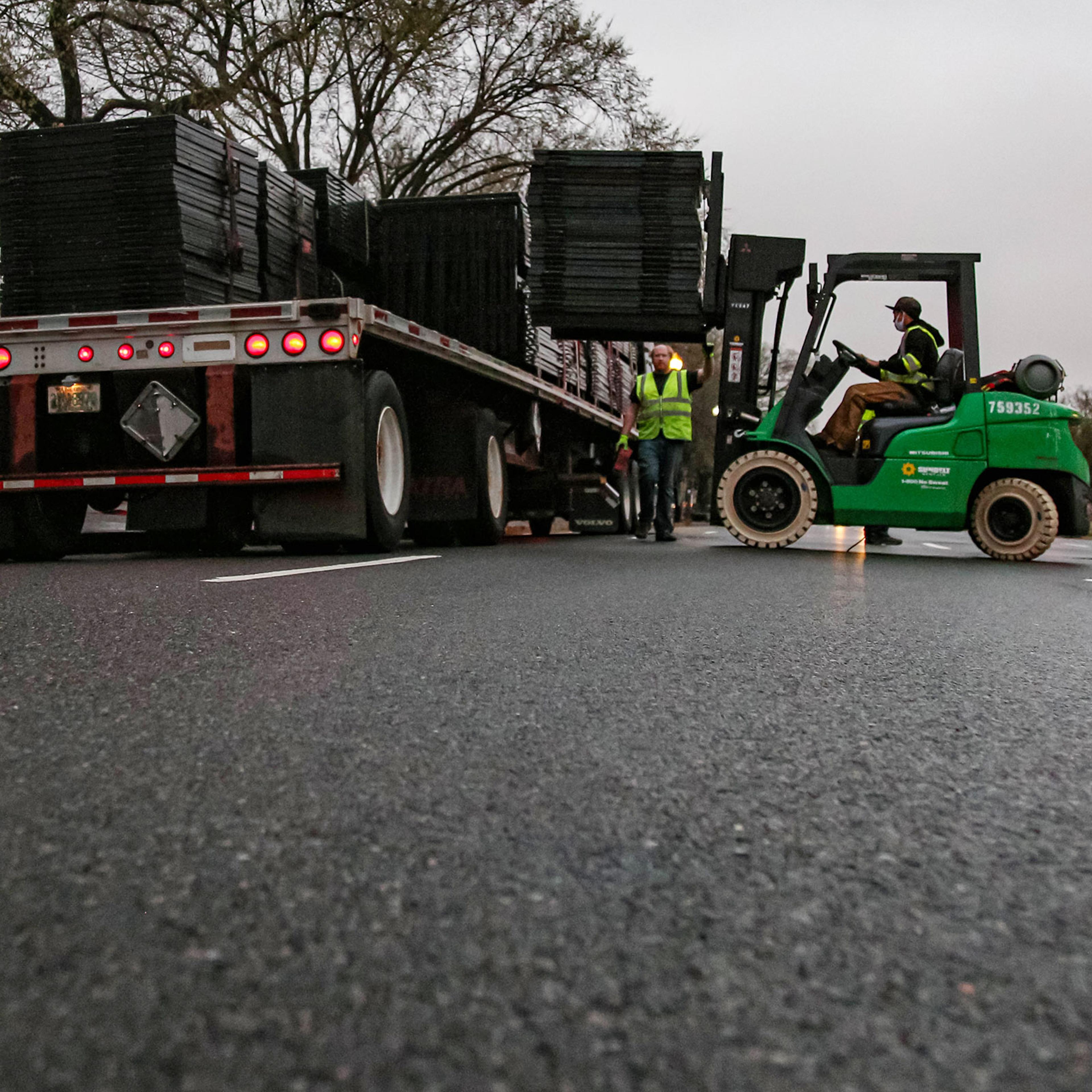 Workers remove fence at White House, Washington DC, USA - 24 Mar 2021