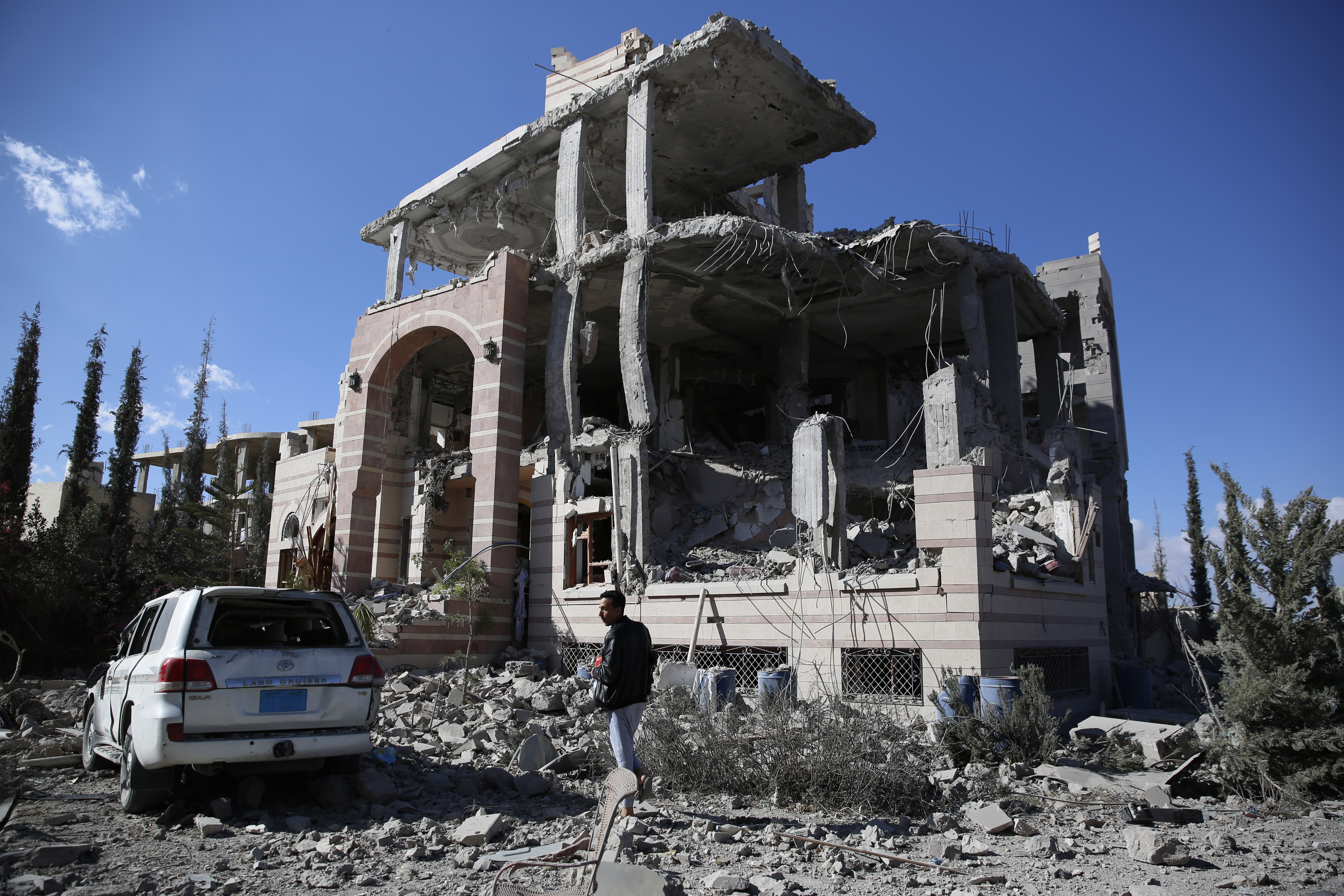 A man inspects his house destroyed by Saudi-led airstrikes in Sanaa, Yemen on Jan. 8, 2016.