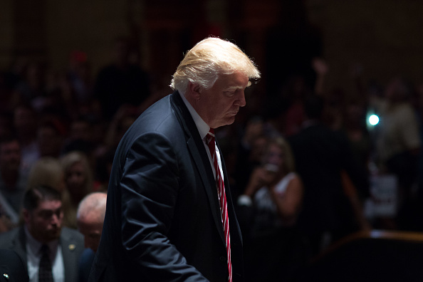 Republican presidential candidate Donald Trump walks on stage after signing autographs during a campaign stop at The Fox Theatre on June 15, 2016 in Atlanta, Georgia.