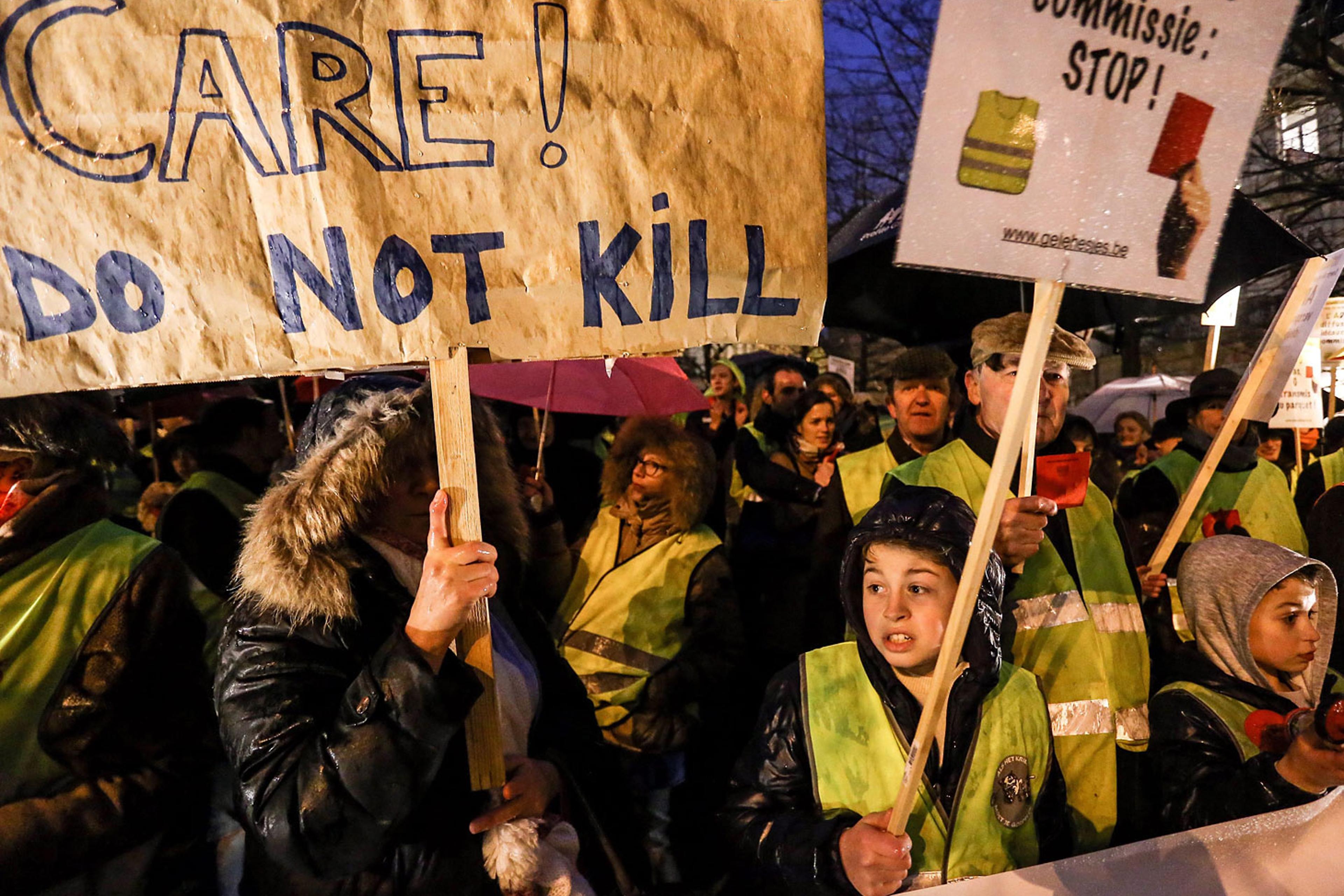 Activists of the collective Yellow Safety Jacket protest against the proposed statutory amendment legalizing the euthanasia of young children, in Brussels, Feb. 11, 2014.