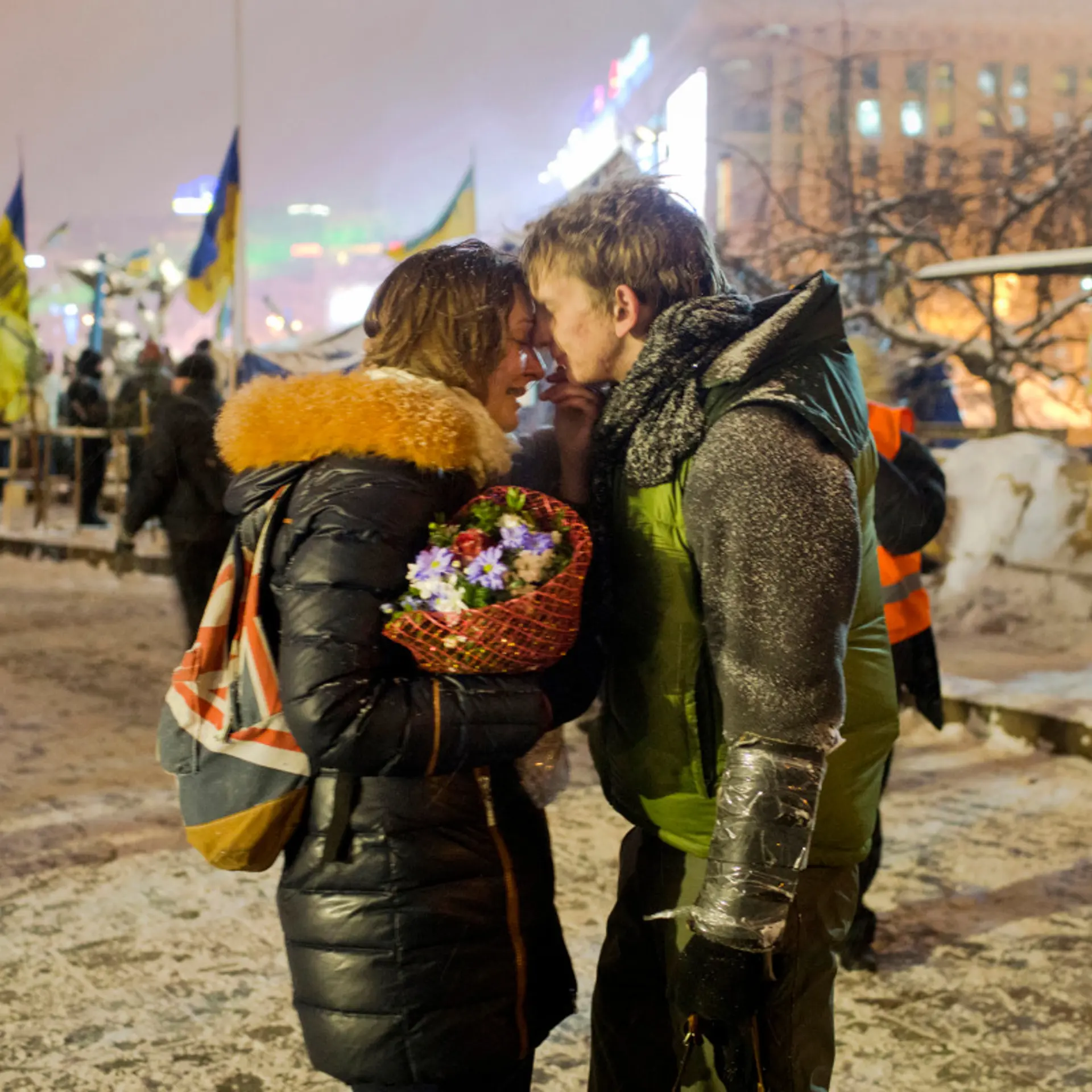 University students Sergey, 19, and Victoria, 20, a young couple from the eastern Ukrainian city of Dnipropetrovsk, embrace on Independence Square before Sergey heads off to Hrushevsky Street a short distance away where a street battle raged for a 4th da