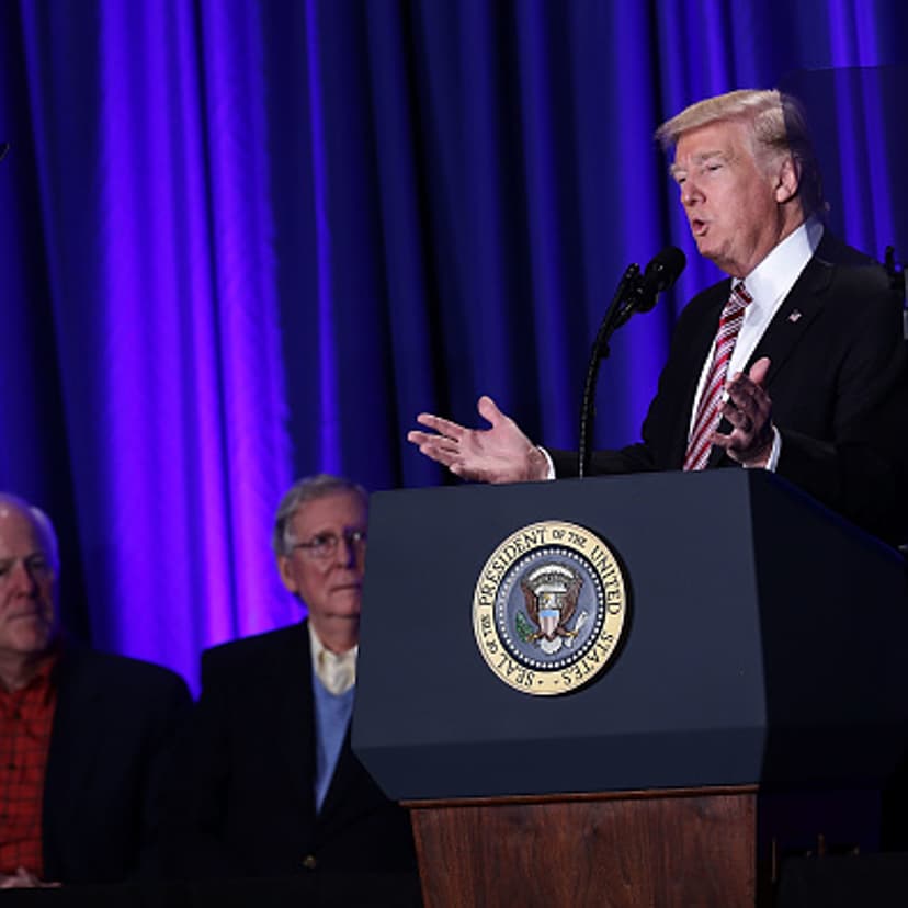 U.S. President Donald Trump (R) speaks as Senate Majority Leader Sen. Mitch McConnell (R-KY) (2nd L) and Senate Majority Whip Sen. John Cornyn (R-TX) (L) look on during a luncheon at the Congress of Tomorrow Republican Member Retreat January 26, 2017 in