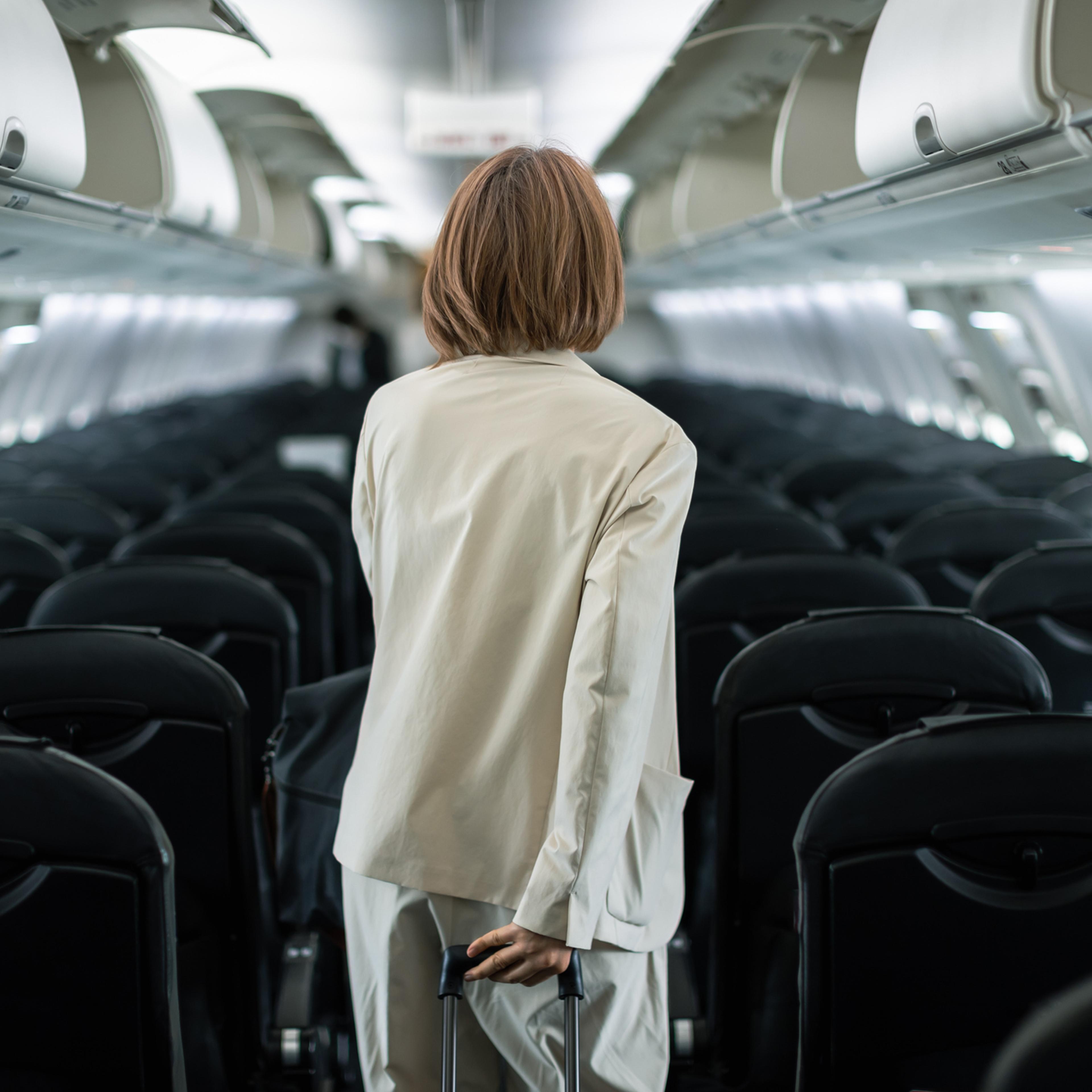 Businesswoman traveling on an airplane to a business destination