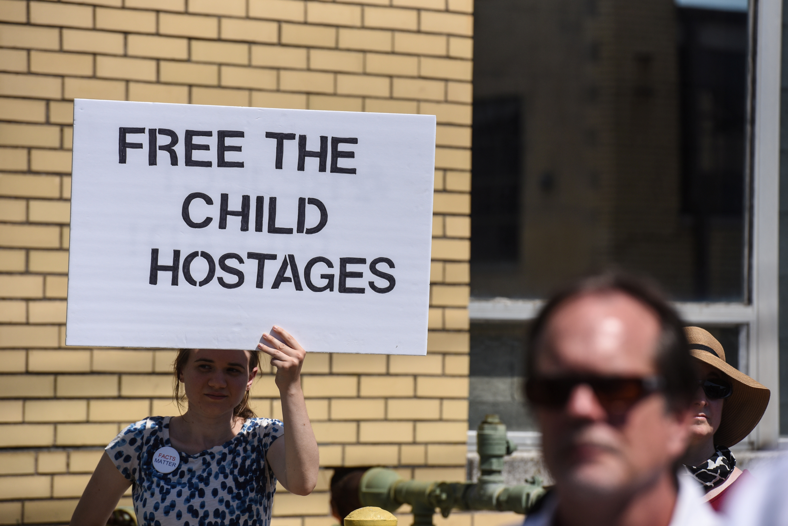 People participate in a protest against recent U.S. immigration policy of separating children from their families when they enter the United States as undocumented immigrants, in front of a Homeland Security facility in Elizabeth