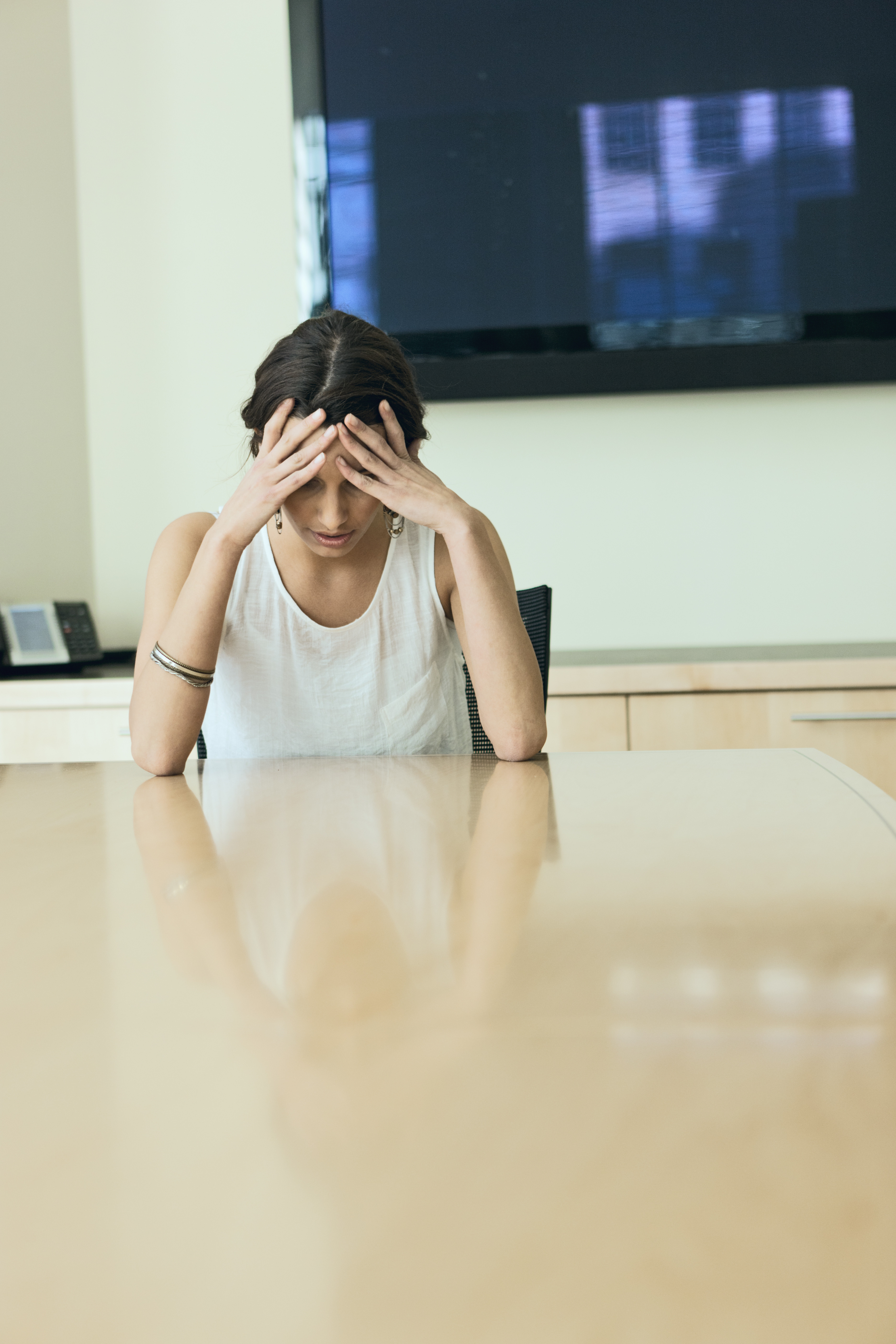 Woman head on desk