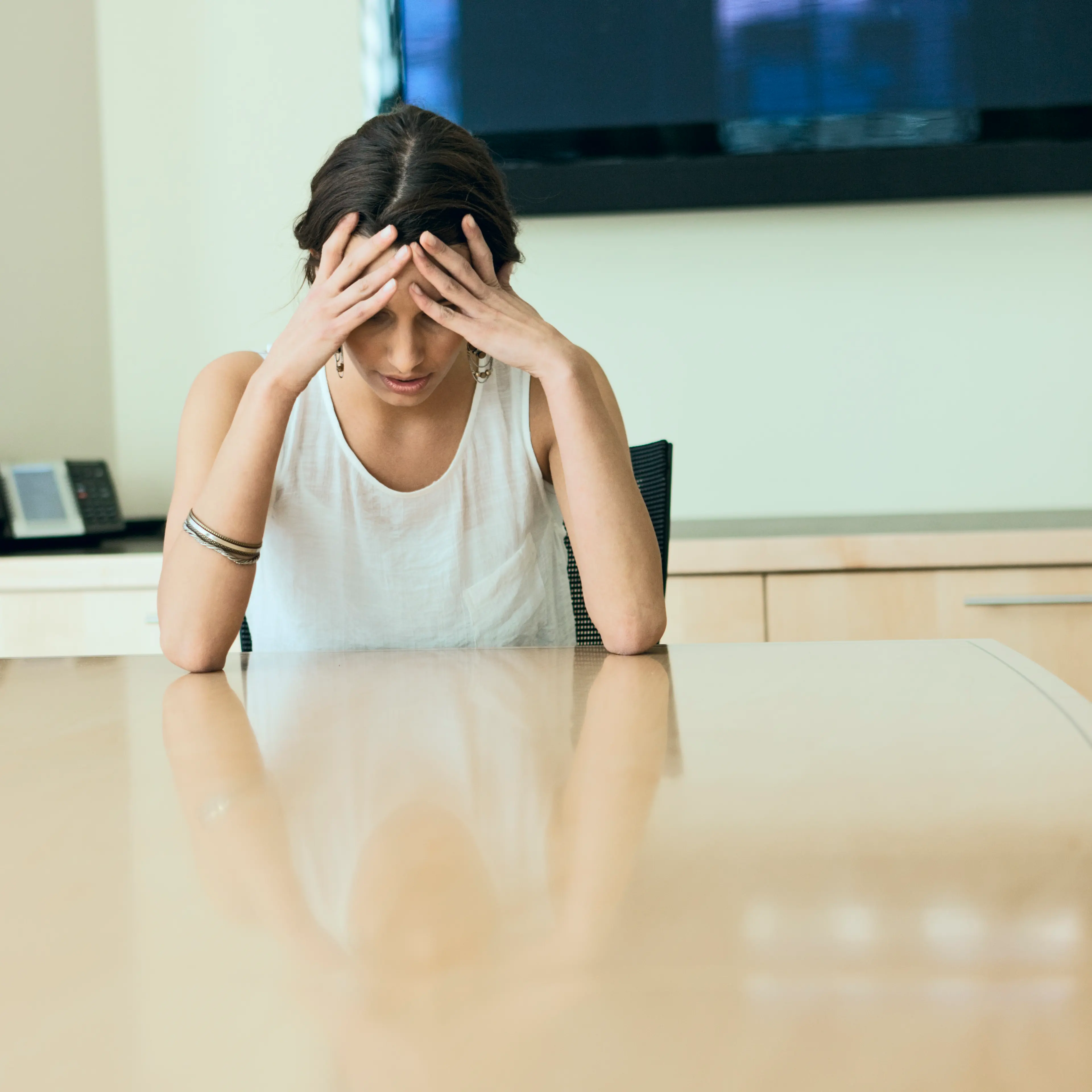 Woman head on desk