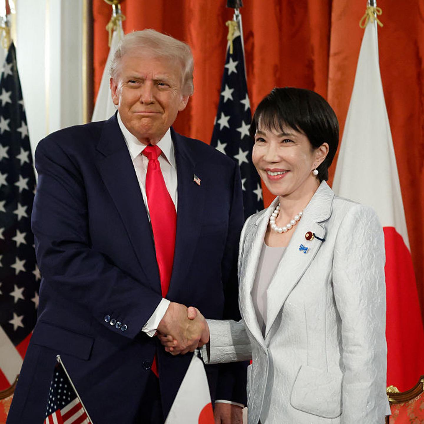 President Donald Trump and Japan's Prime Minister Sanae Takaichi pose for photographs following a signing ceremony at the Akasaka State Guest House in Tokyo on October 28, 2025.