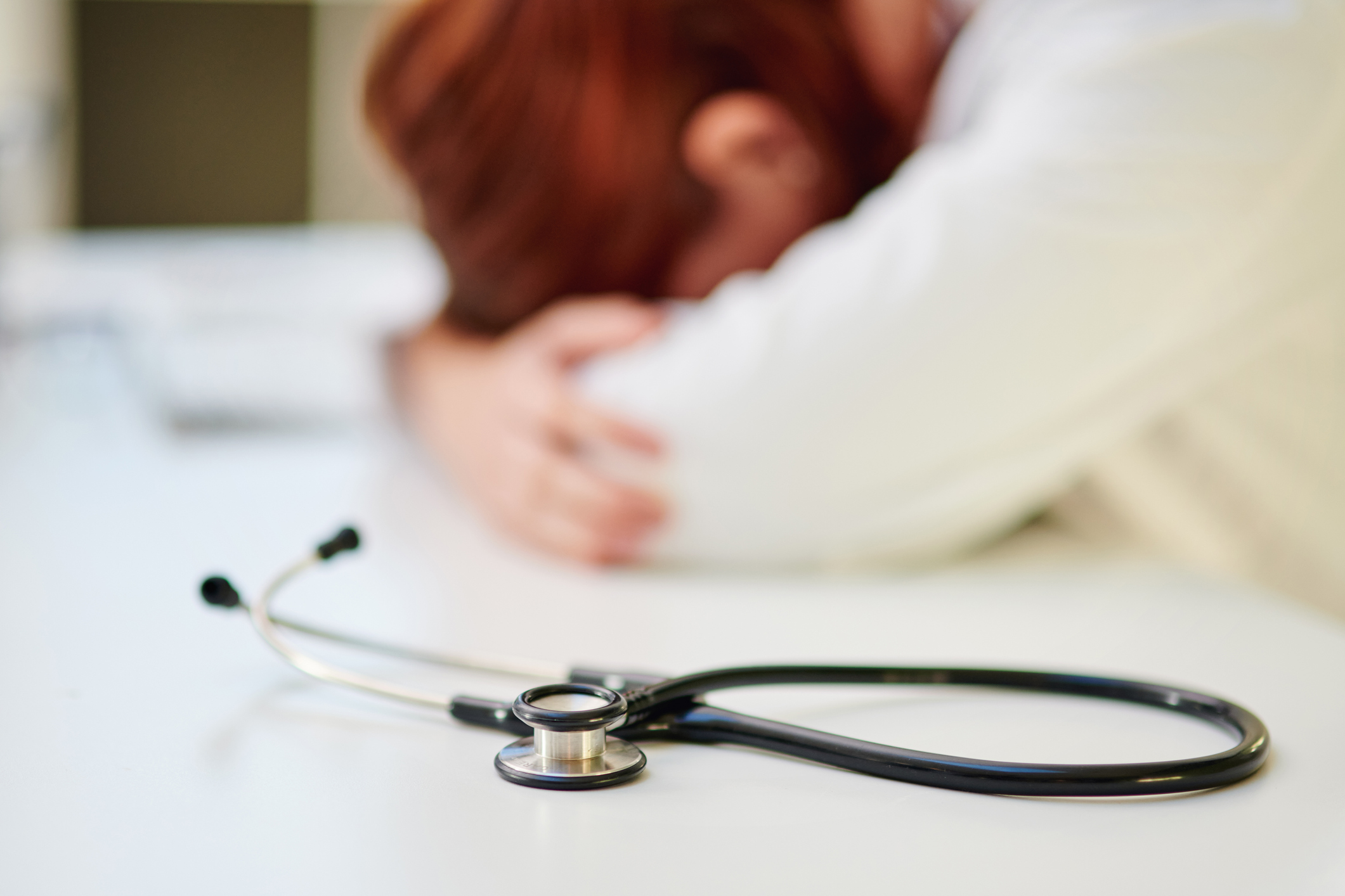 Shot of a young doctor sleeping at her desk