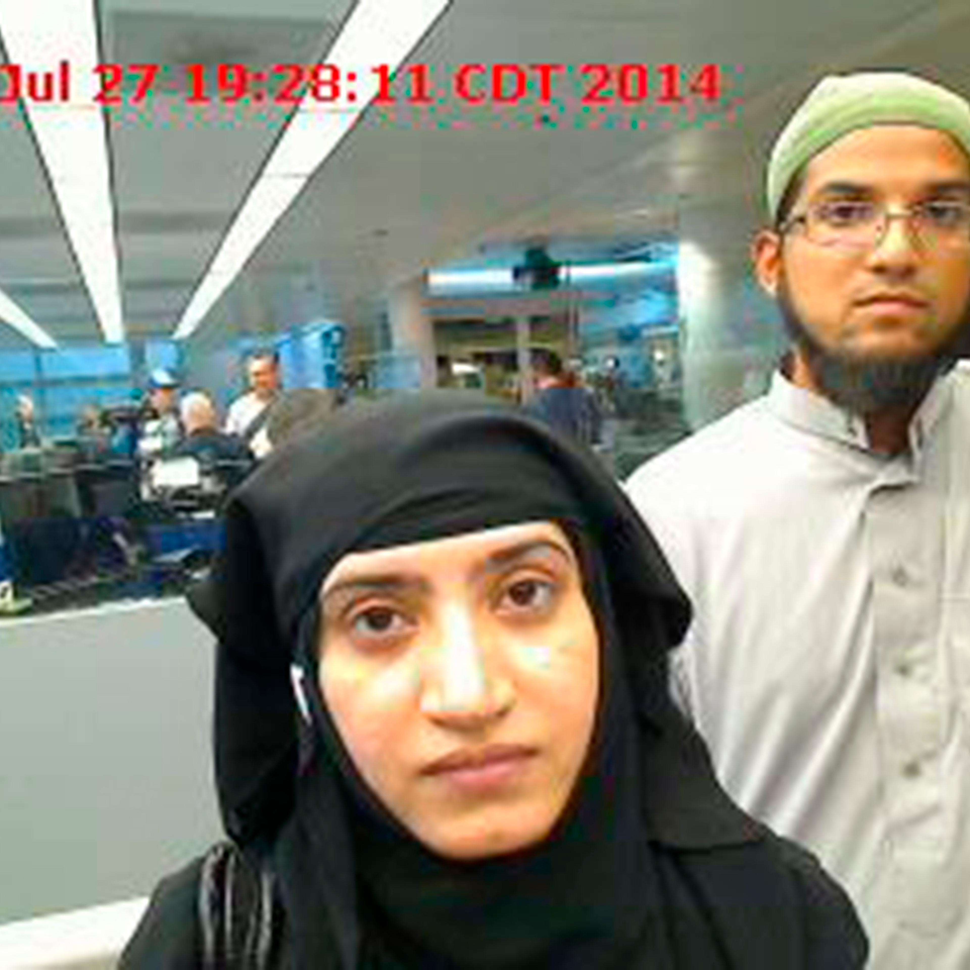 Tashfeen Malik and Syed Farook are pictured passing through Chicago's O'Hare International Airport in this July 27, 2014 handout photo