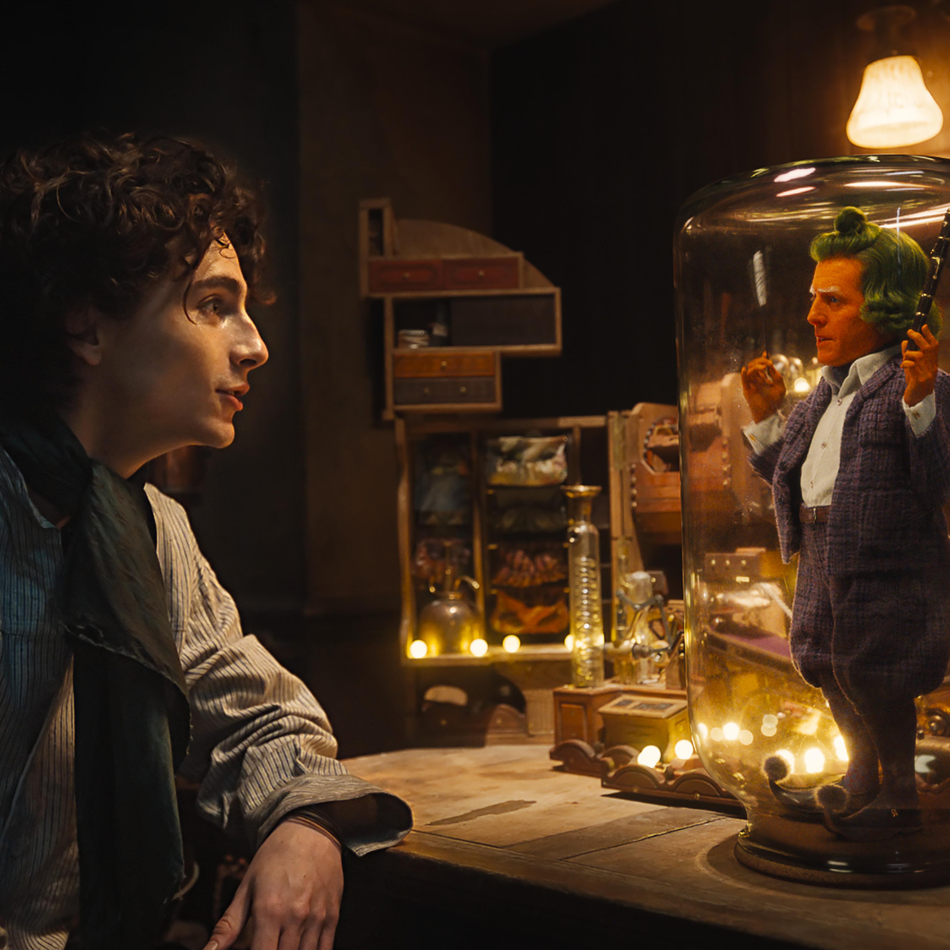 Timothée Chalamet as Willy Wonka and Hugh Grant as an Oompa Loompa in 'Wonka'