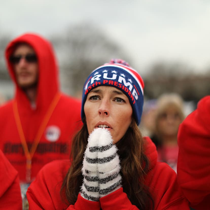 U.S. President Donald Trump supporters pray on the National Mall during the inauguration of US President Donald Trump on January 20, 2017 in Washington, D.C.