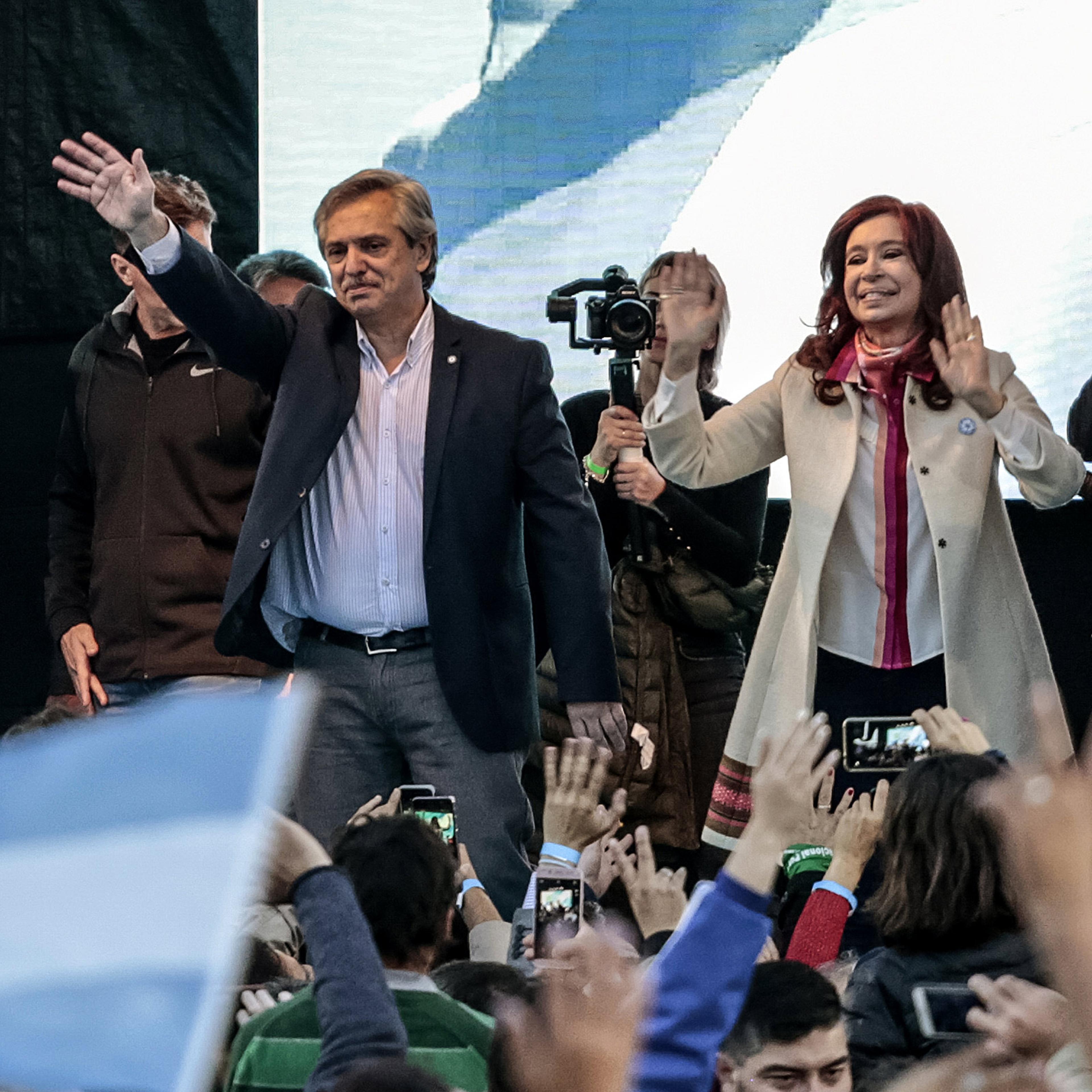 Presidential candidate Alberto Fernandez and former president of Argentina Cristina Fernandez de Kirchner wave to attendees during their first campaign event in Merlo, Argentina, on May 25.
