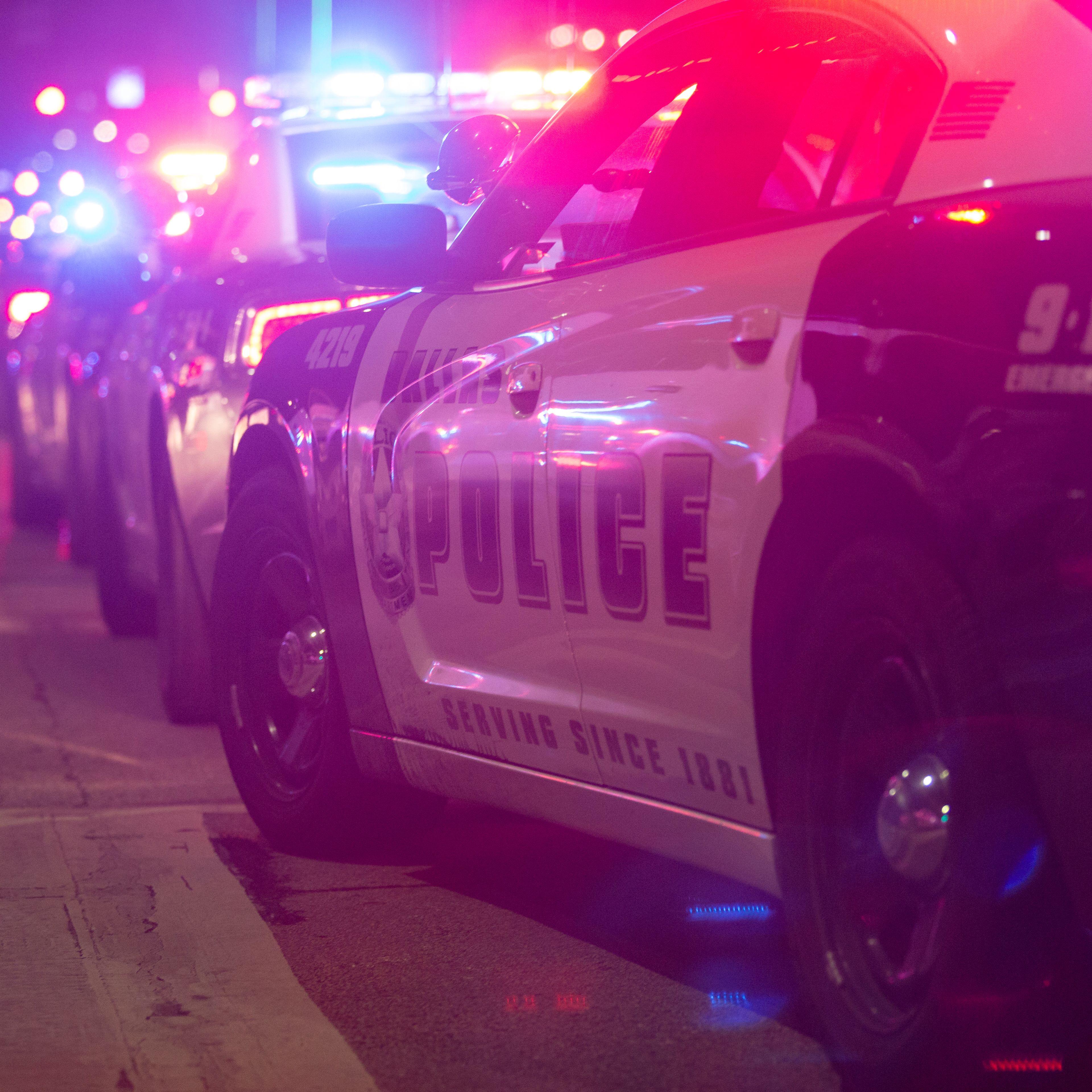 Police cars sit on Main Street in Dallas following the sniper shooting during a protest on July 7, 2016.